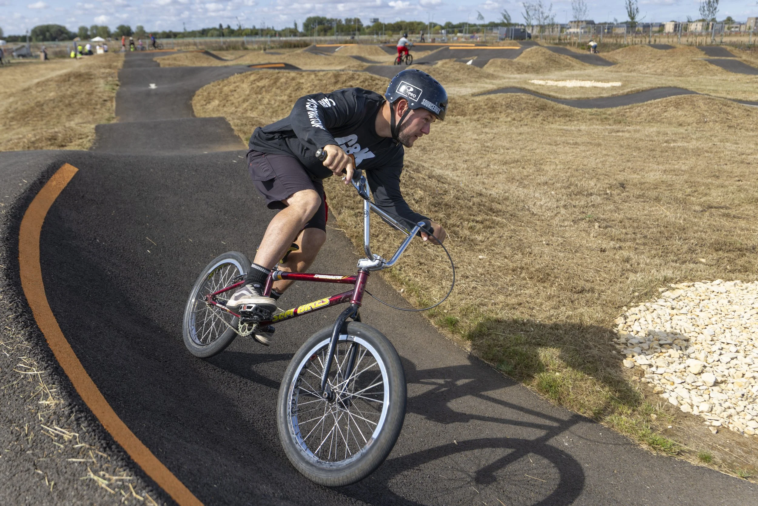 A man on a bike at Northstowe Pump Track.
