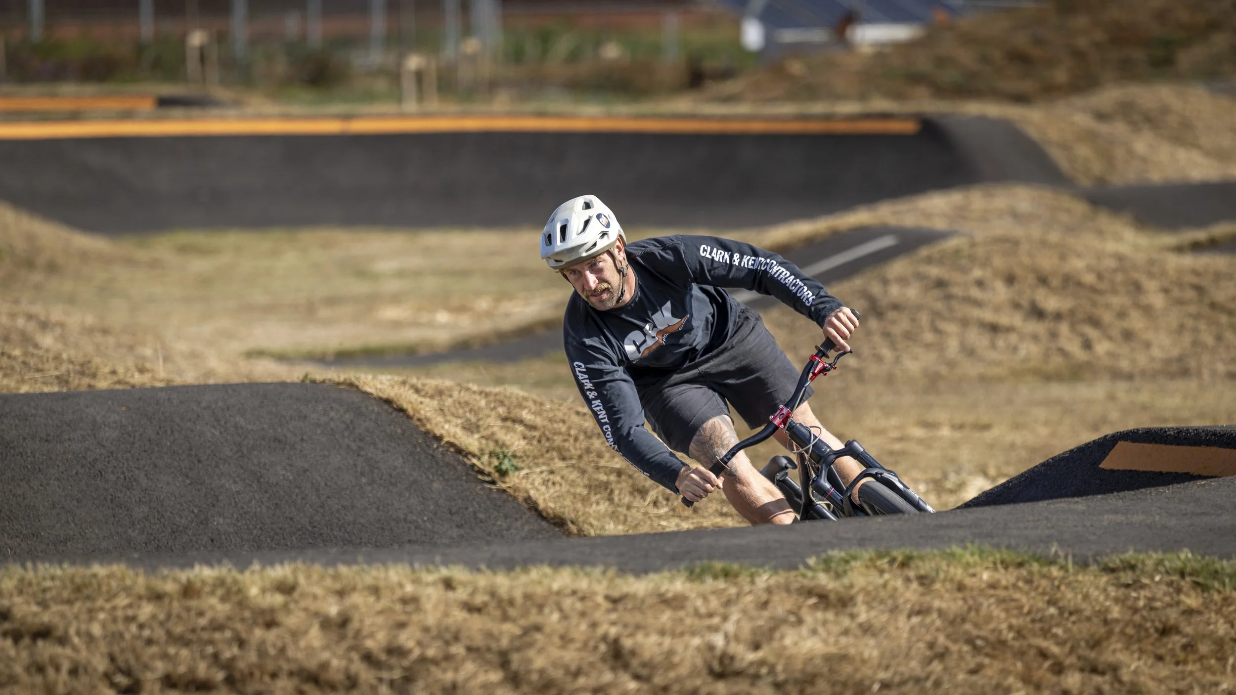 A man on a bike at Northstowe Pump Track.