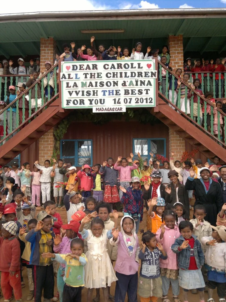 It's hard to believe I’ve been partnering with La Maison d’Aina since 2012. Their sustainable approach and community-oriented workshops continue to impress me. When I was diagnosed with breast cancer in 2012, La Maison d’Aina organized to send me this heartwarming photo. I’m healthy now, and plan to continue to support the collective just like they supported me.