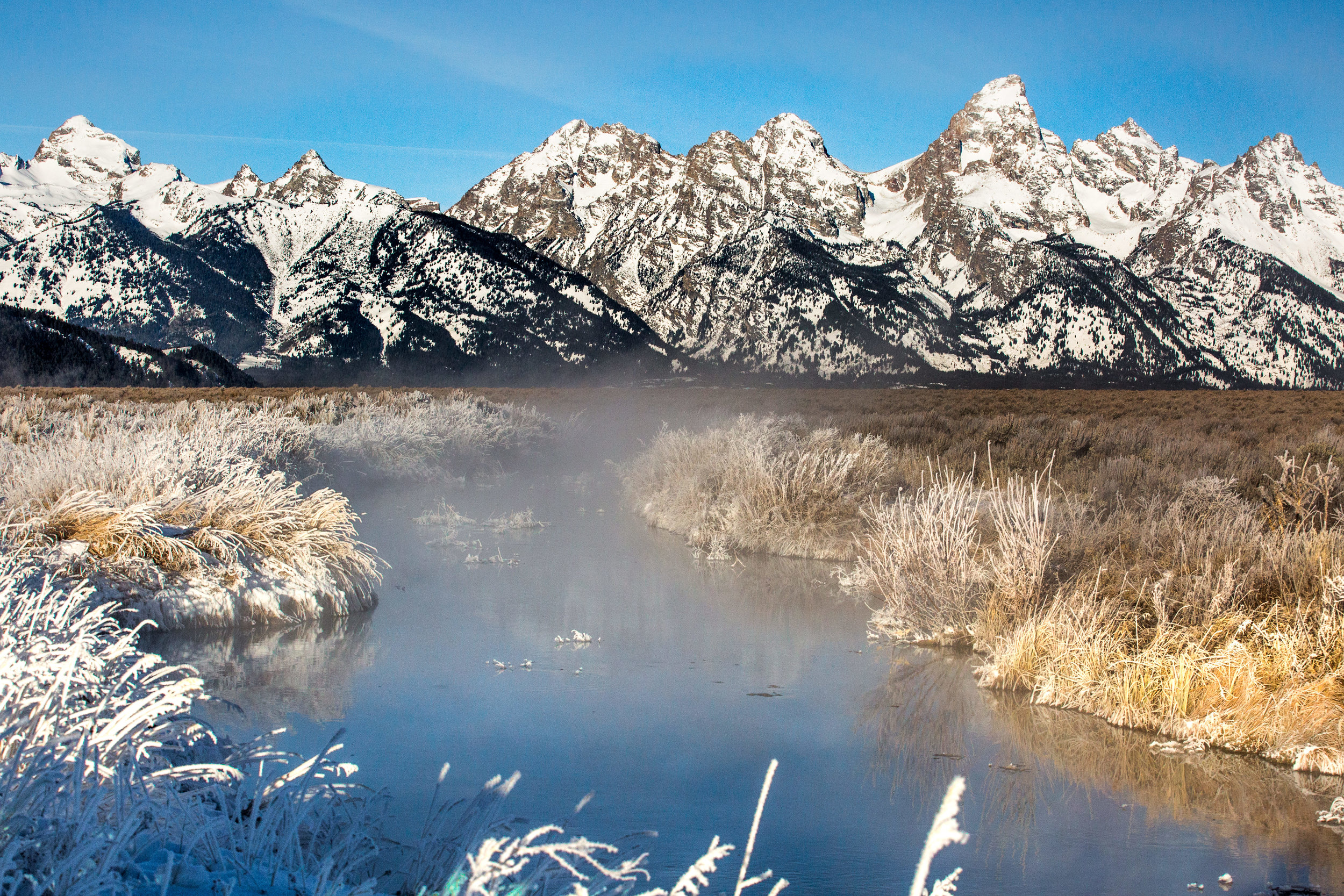 nicole-daacke-photography-jackson-hole-grand-teton-national-park-elopement-wedding-photographer-adventurous-engagement-session-grand-tetons-snow-visit-itinerary-for-jackson-hole-wyoming-9736.jpg