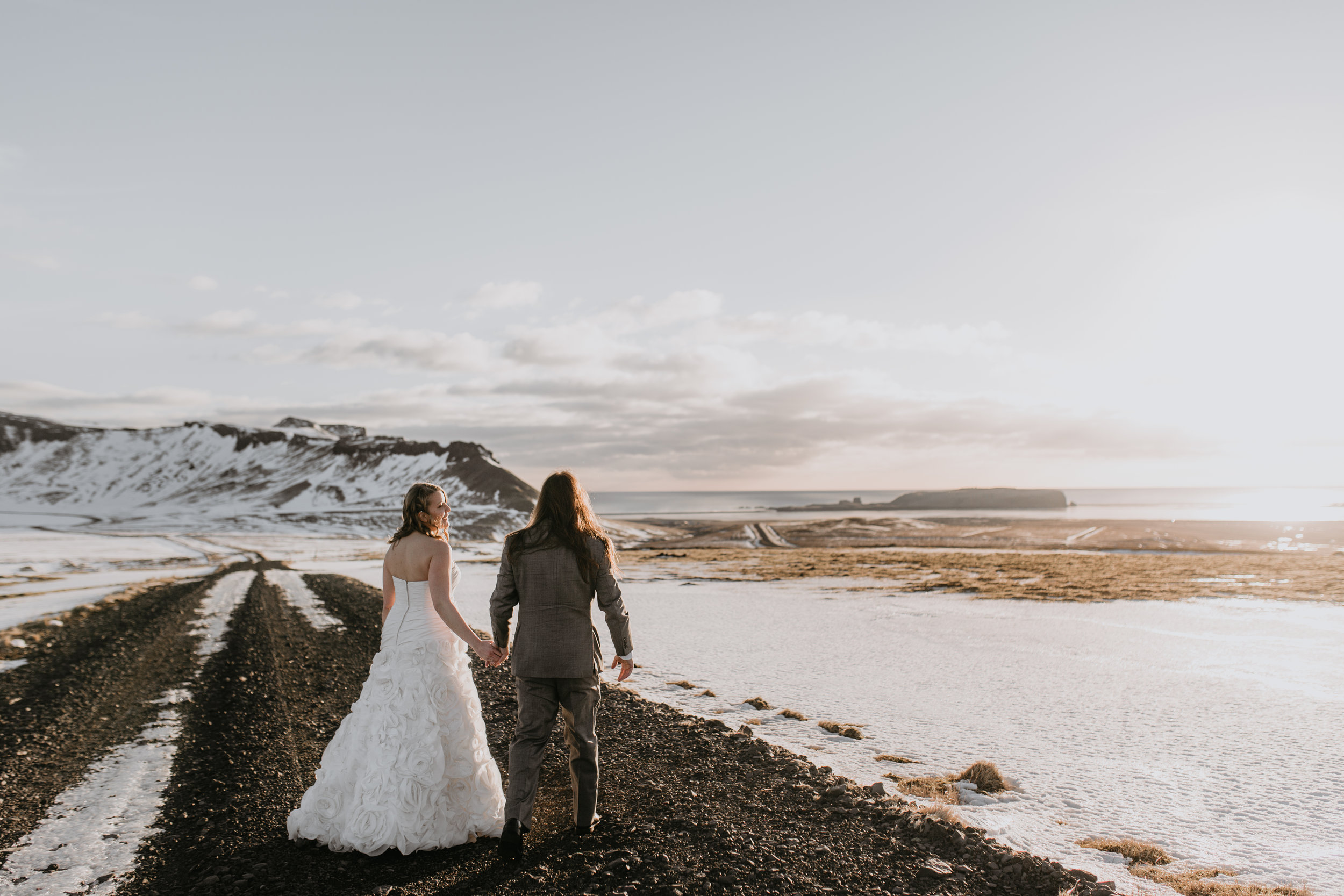 nicole-daacke-photography-iceland-winter-sunset-adventure-elopement-skogafoss-waterfall-black-sand-beach-dyrholaey-vik-iceland-intimate-wedding-black-church-elopement-photographer-13.jpg