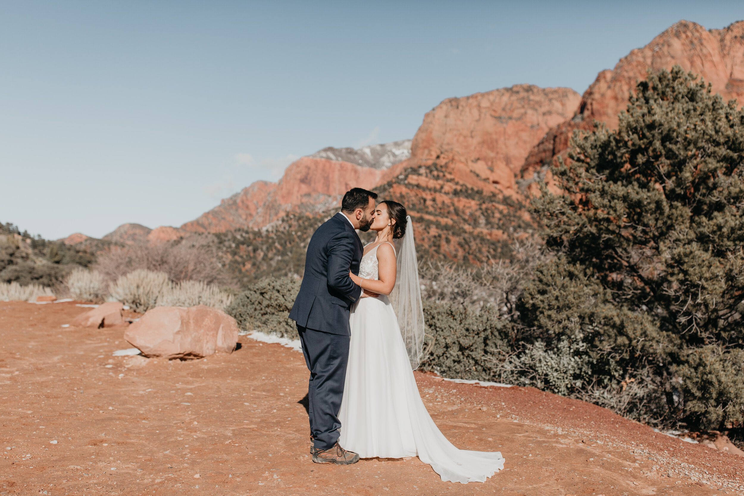 Nicole-Daacke-Photography-snowy-hiking-elopement-in-zion-national-park-zion-elopement-photographer-canyon-overlook-trial-brial-portraits-in-mt-zion-national-park-utah-desert-adventure-elopement-photographer-106.jpg