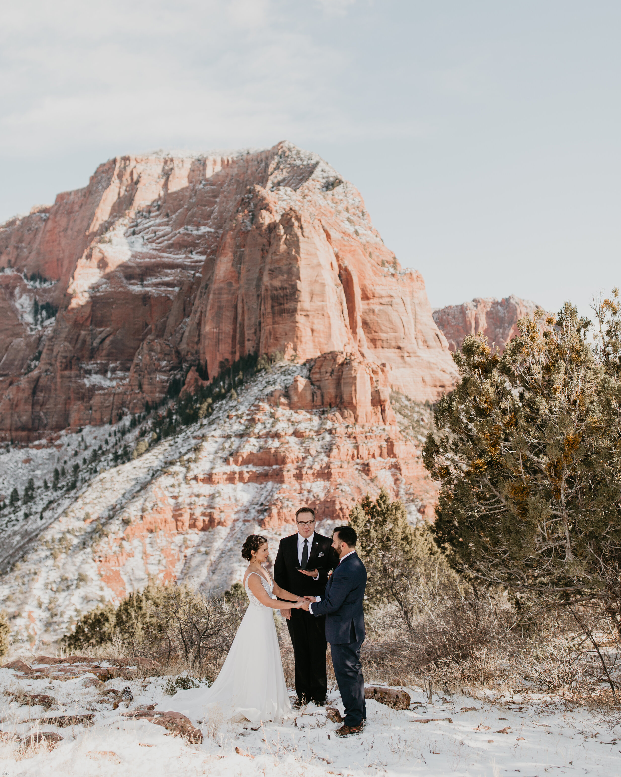 Nicole-Daacke-Photography-snowy-hiking-elopement-in-zion-national-park-zion-elopement-photographer-canyon-overlook-trial-brial-portraits-in-mt-zion-national-park-utah-desert-adventure-elopement-photographer-109.jpg