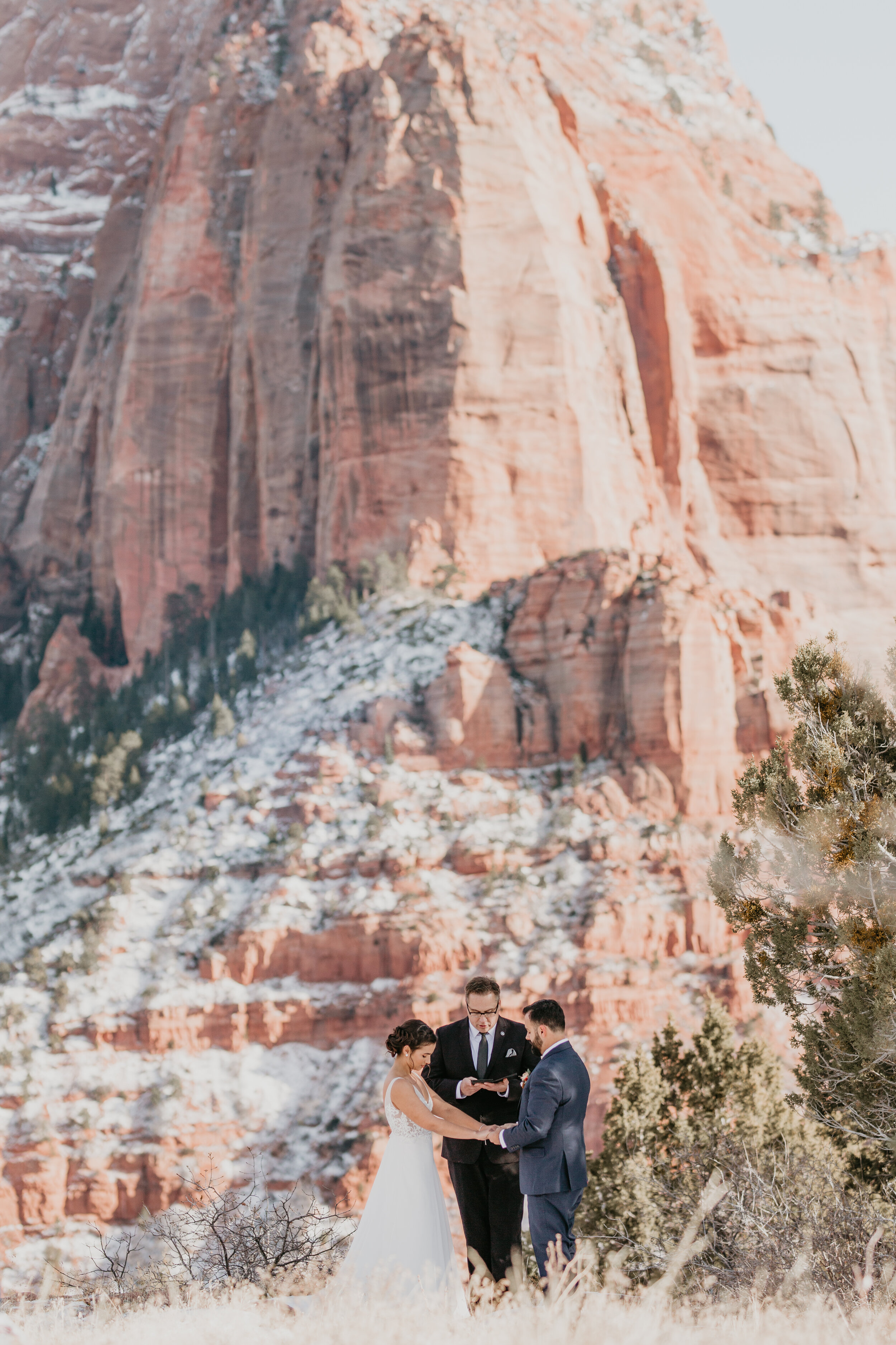 Nicole-Daacke-Photography-snowy-hiking-elopement-in-zion-national-park-zion-elopement-photographer-canyon-overlook-trial-brial-portraits-in-mt-zion-national-park-utah-desert-adventure-elopement-photographer-117.jpg