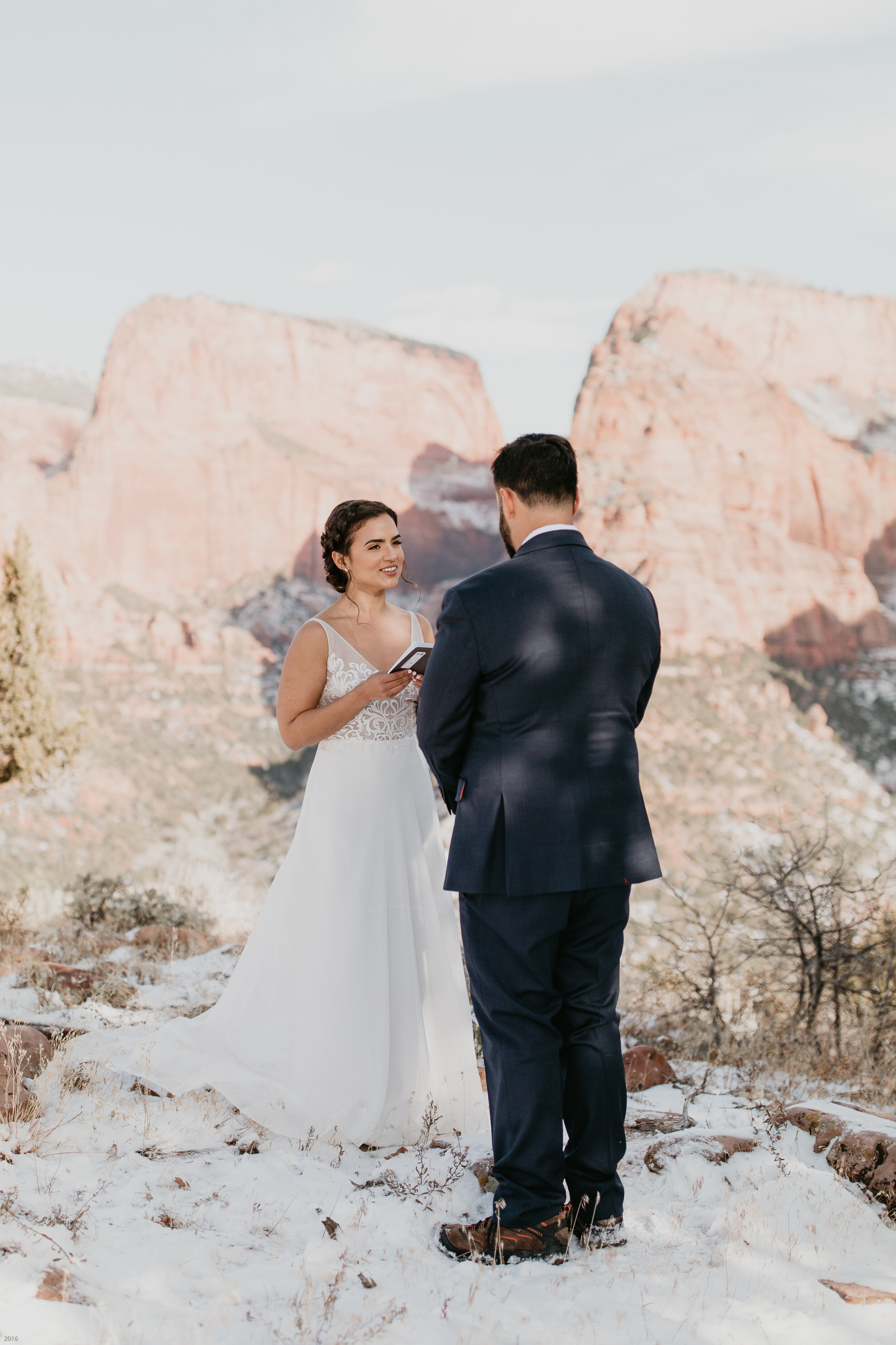 Nicole-Daacke-Photography-snowy-hiking-elopement-in-zion-national-park-zion-elopement-photographer-canyon-overlook-trial-brial-portraits-in-mt-zion-national-park-utah-desert-adventure-elopement-photographer-123.jpg