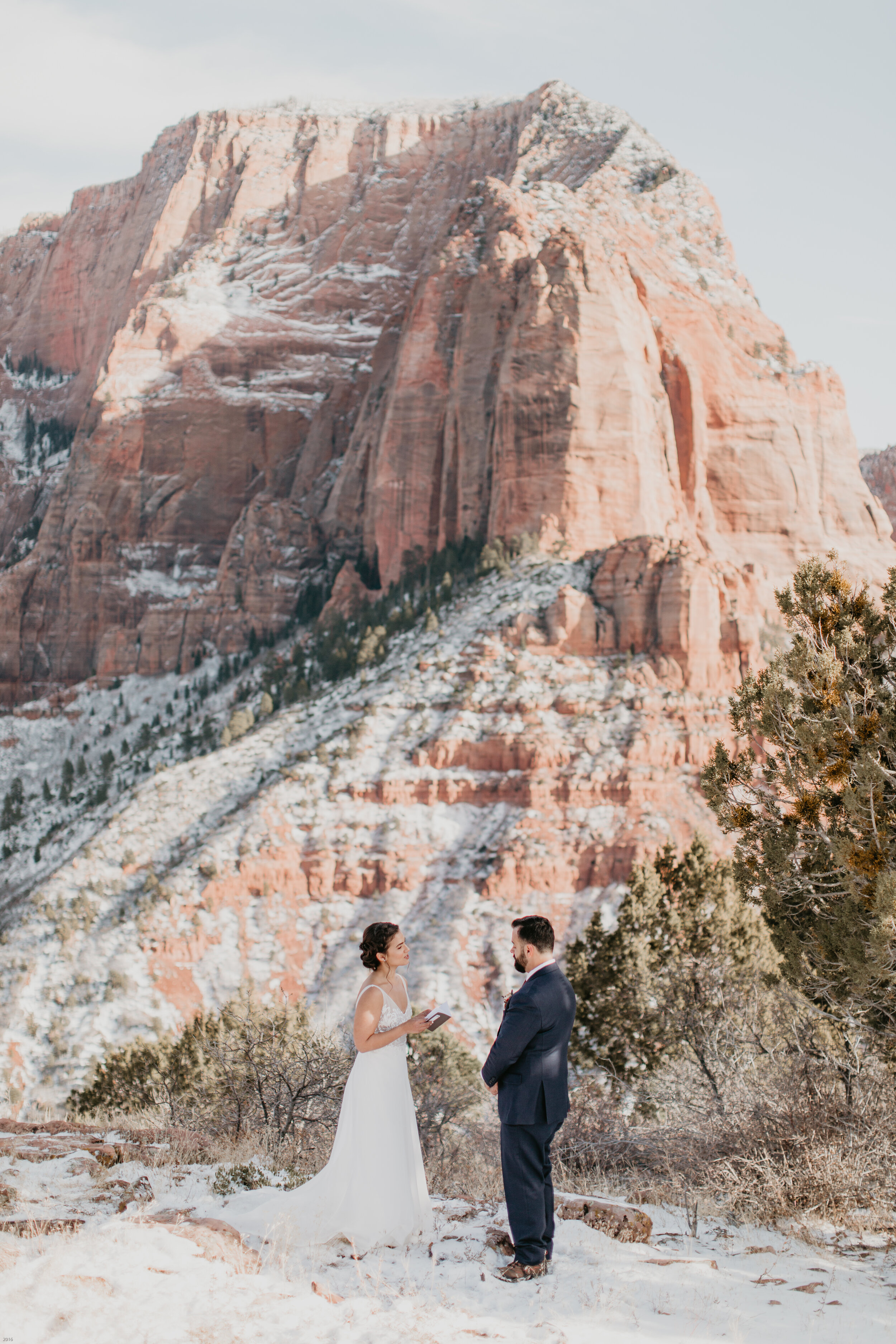 Nicole-Daacke-Photography-snowy-hiking-elopement-in-zion-national-park-zion-elopement-photographer-canyon-overlook-trial-brial-portraits-in-mt-zion-national-park-utah-desert-adventure-elopement-photographer-125.jpg