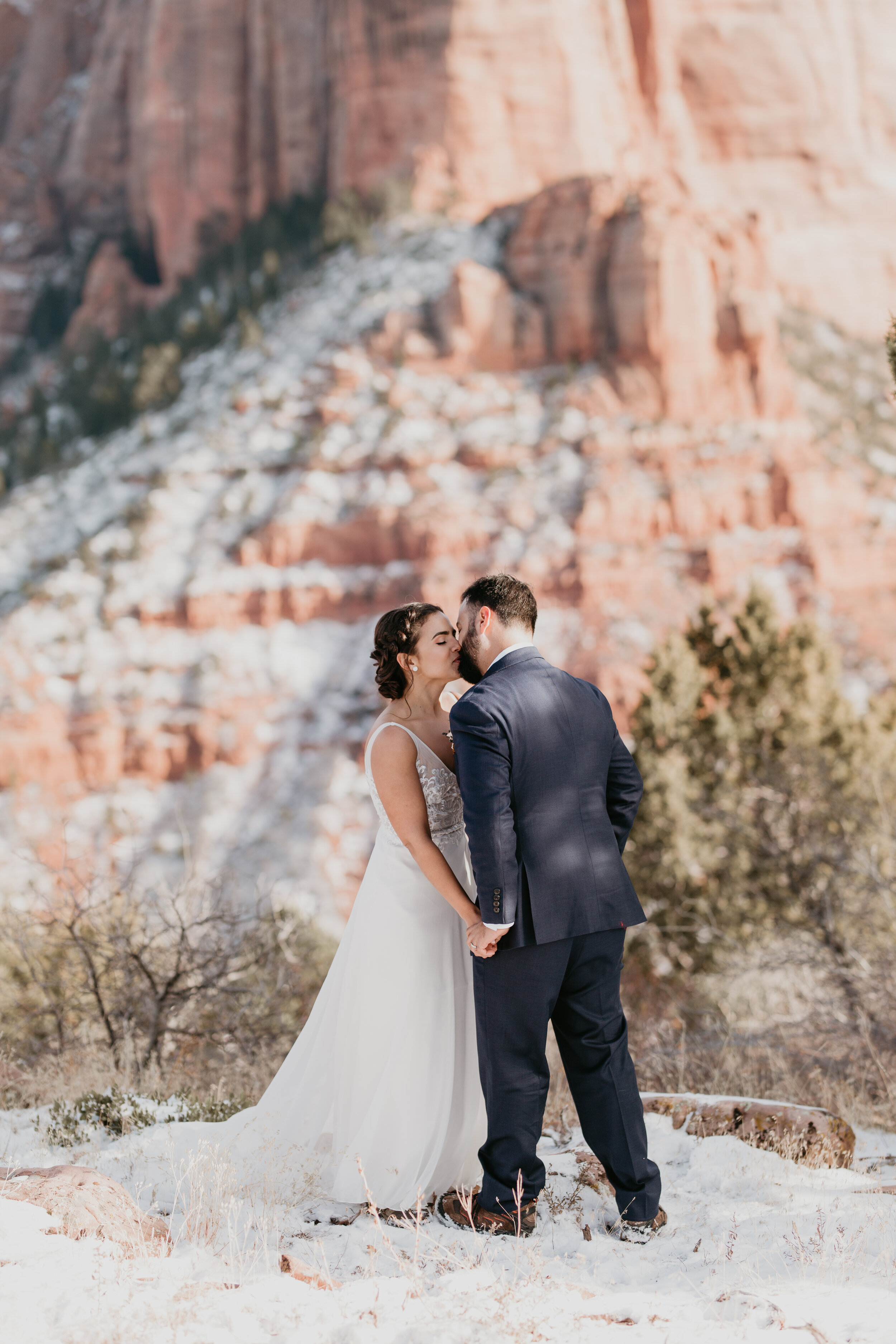 Nicole-Daacke-Photography-snowy-hiking-elopement-in-zion-national-park-zion-elopement-photographer-canyon-overlook-trial-brial-portraits-in-mt-zion-national-park-utah-desert-adventure-elopement-photographer-129.jpg