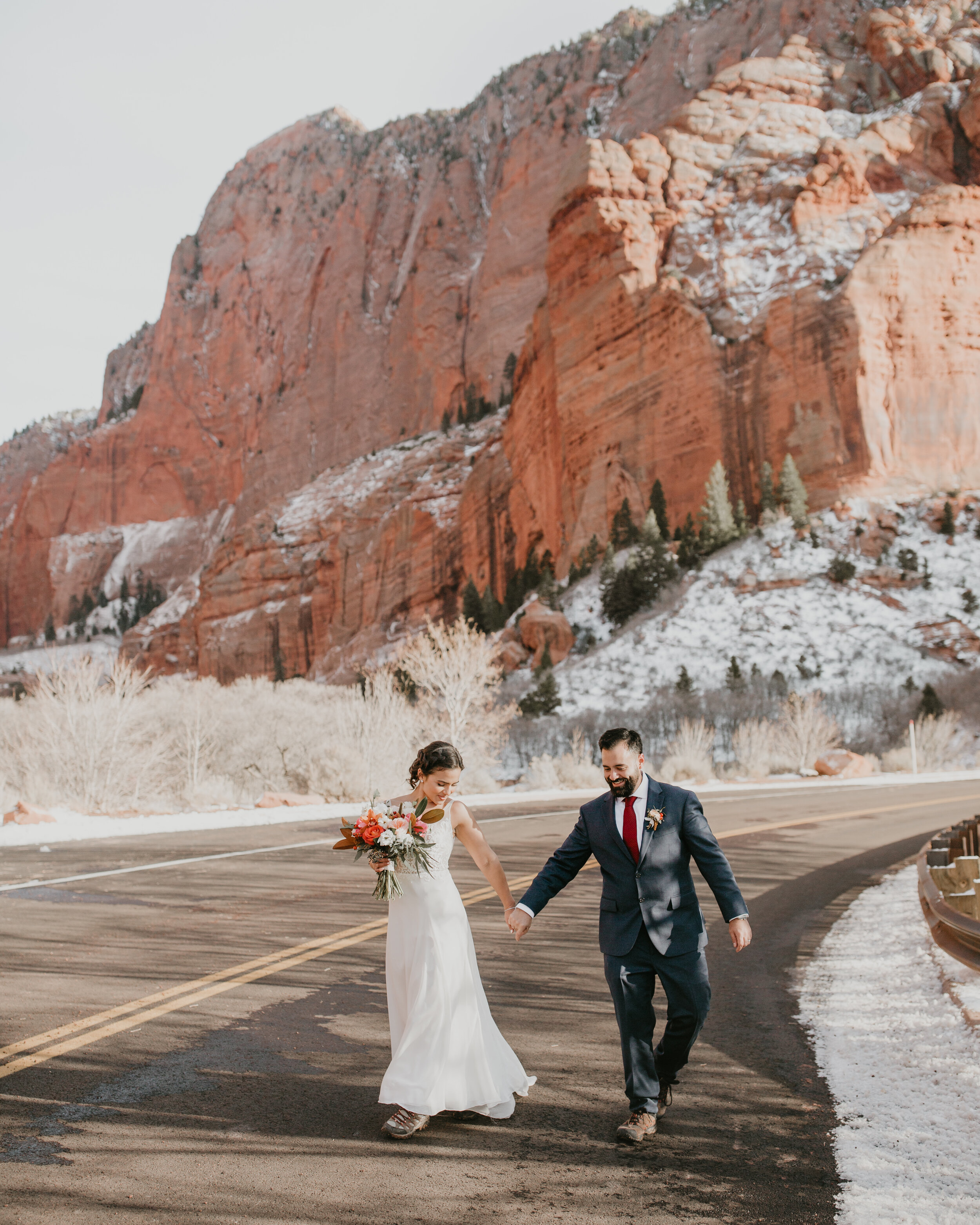 Nicole-Daacke-Photography-snowy-hiking-elopement-in-zion-national-park-zion-elopement-photographer-canyon-overlook-trial-brial-portraits-in-mt-zion-national-park-utah-desert-adventure-elopement-photographer-133.jpg