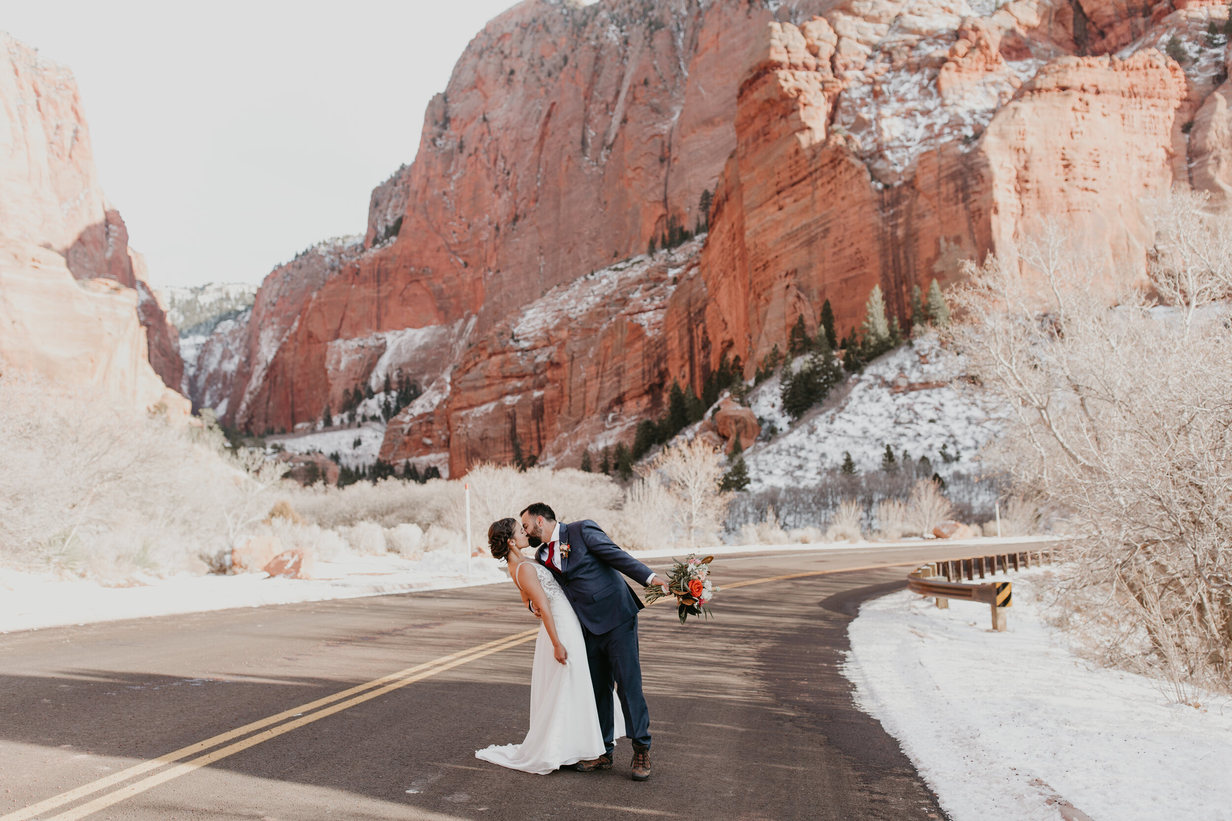 Nicole-Daacke-Photography-snowy-hiking-elopement-in-zion-national-park-zion-elopement-photographer-canyon-overlook-trial-brial-portraits-in-mt-zion-national-park-utah-desert-adventure-elopement-photographer-135.jpg