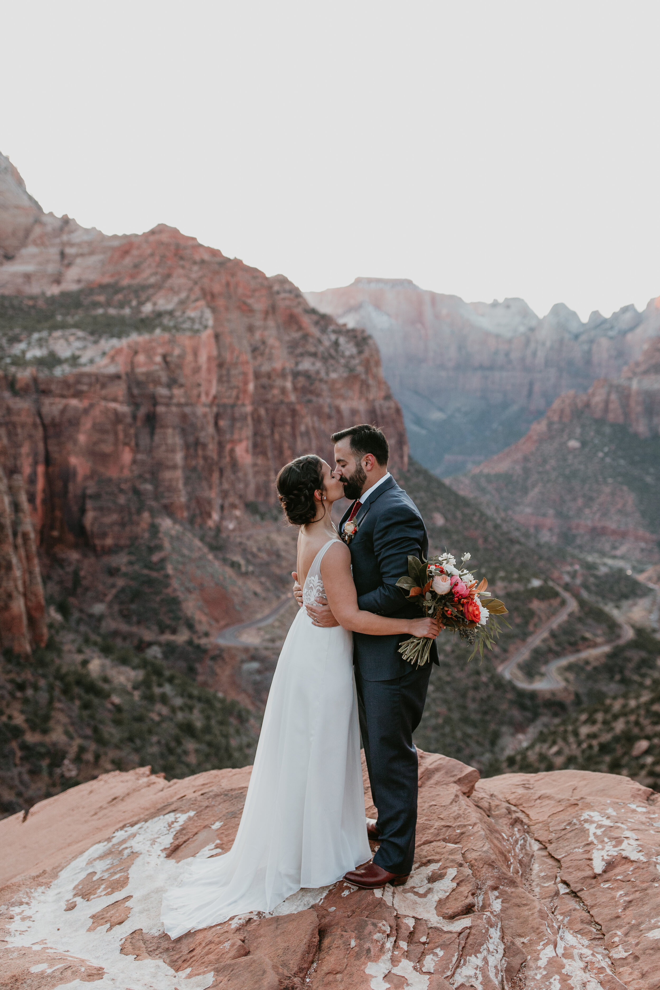 Nicole-Daacke-Photography-snowy-hiking-elopement-in-zion-national-park-zion-elopement-photographer-canyon-overlook-trial-brial-portraits-in-mt-zion-national-park-utah-desert-adventure-elopement-photographer-151.jpg