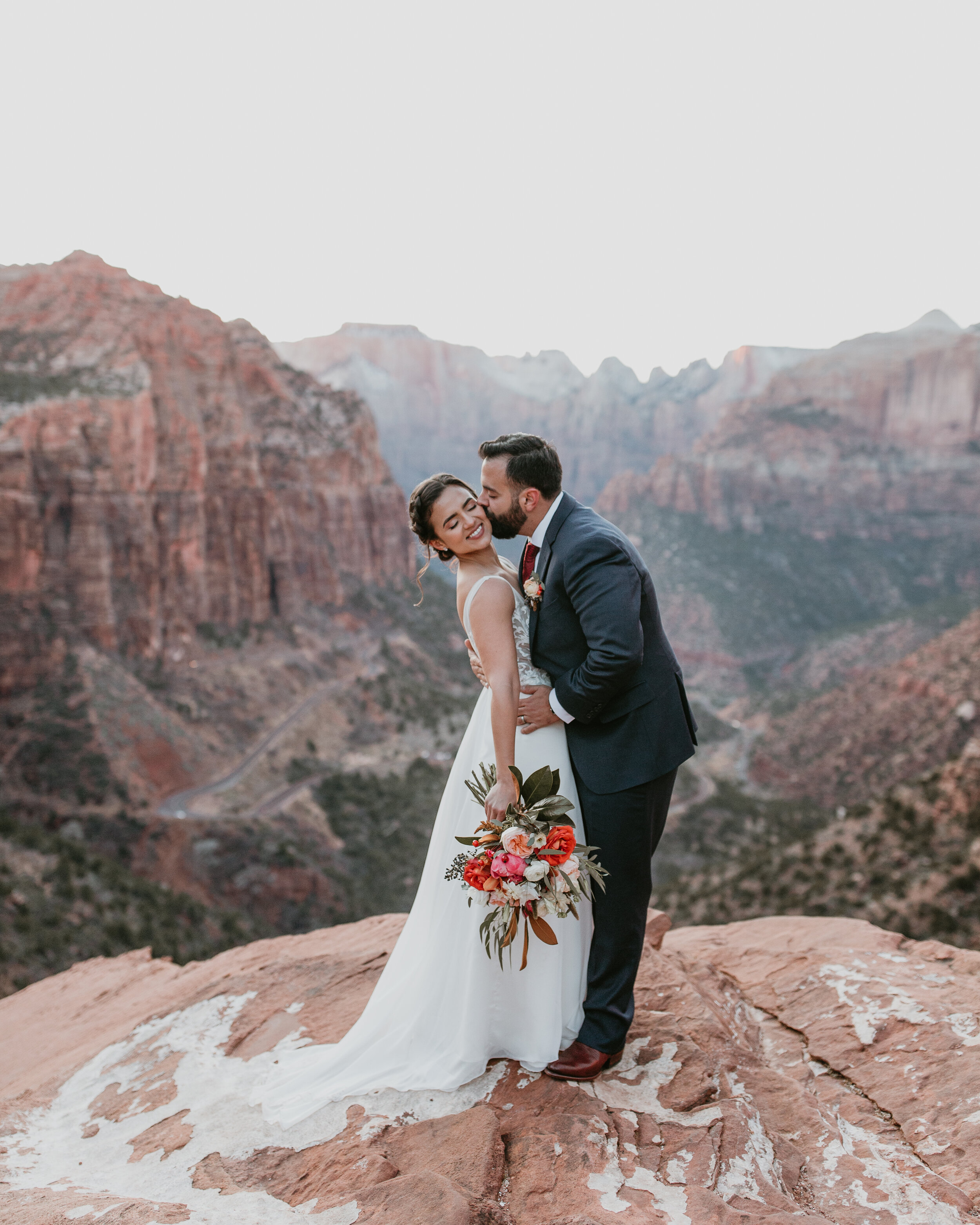 Nicole-Daacke-Photography-snowy-hiking-elopement-in-zion-national-park-zion-elopement-photographer-canyon-overlook-trial-brial-portraits-in-mt-zion-national-park-utah-desert-adventure-elopement-photographer-152.jpg