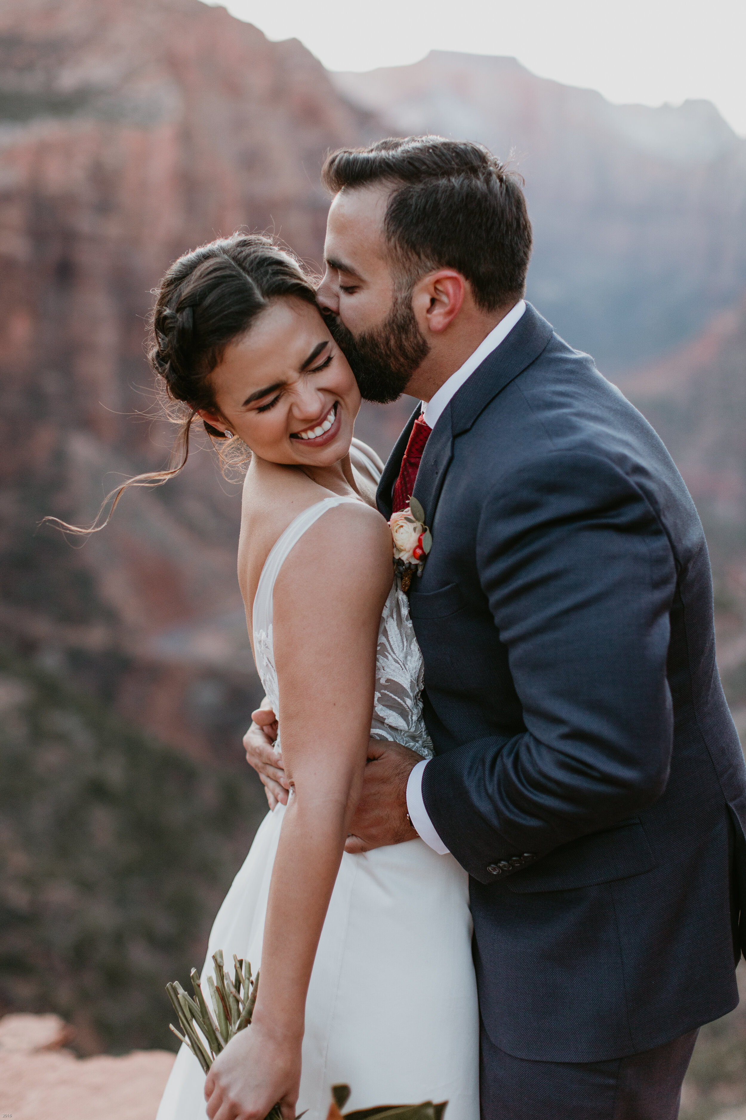 Nicole-Daacke-Photography-snowy-hiking-elopement-in-zion-national-park-zion-elopement-photographer-canyon-overlook-trial-brial-portraits-in-mt-zion-national-park-utah-desert-adventure-elopement-photographer-153.jpg
