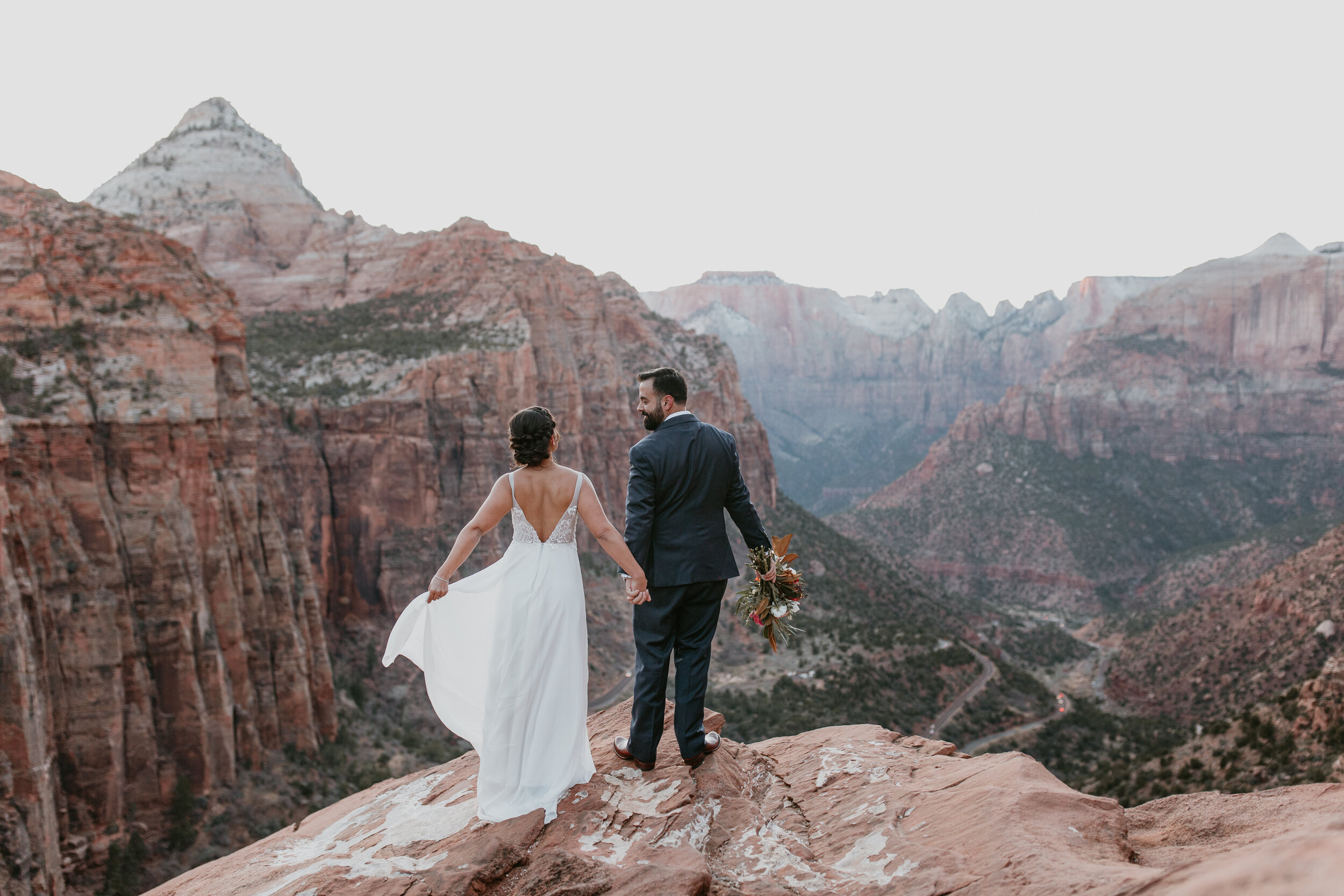 Nicole-Daacke-Photography-snowy-hiking-elopement-in-zion-national-park-zion-elopement-photographer-canyon-overlook-trial-brial-portraits-in-mt-zion-national-park-utah-desert-adventure-elopement-photographer-155.jpg