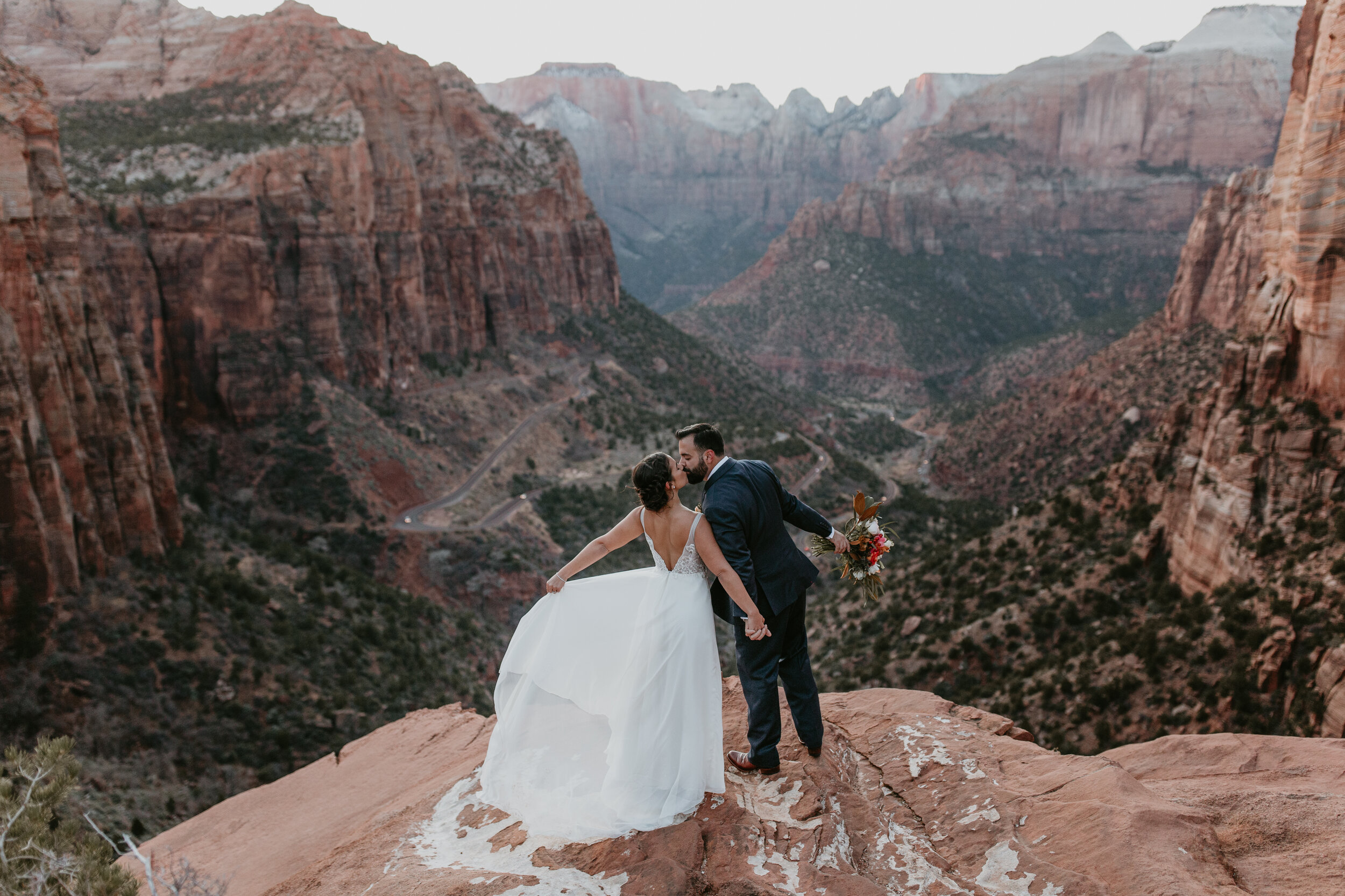 Nicole-Daacke-Photography-snowy-hiking-elopement-in-zion-national-park-zion-elopement-photographer-canyon-overlook-trial-brial-portraits-in-mt-zion-national-park-utah-desert-adventure-elopement-photographer-156.jpg