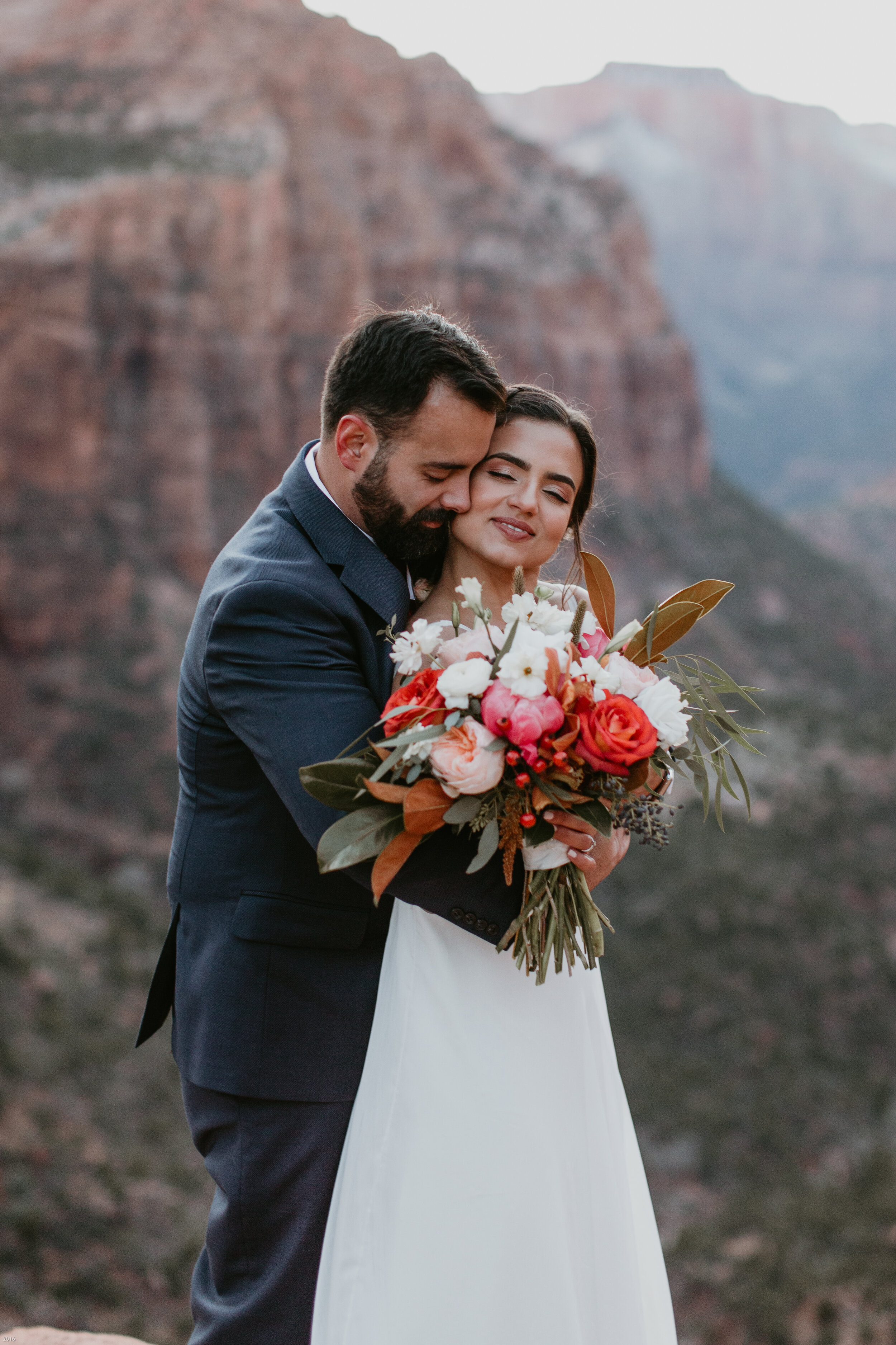 Nicole-Daacke-Photography-snowy-hiking-elopement-in-zion-national-park-zion-elopement-photographer-canyon-overlook-trial-brial-portraits-in-mt-zion-national-park-utah-desert-adventure-elopement-photographer-158.jpg