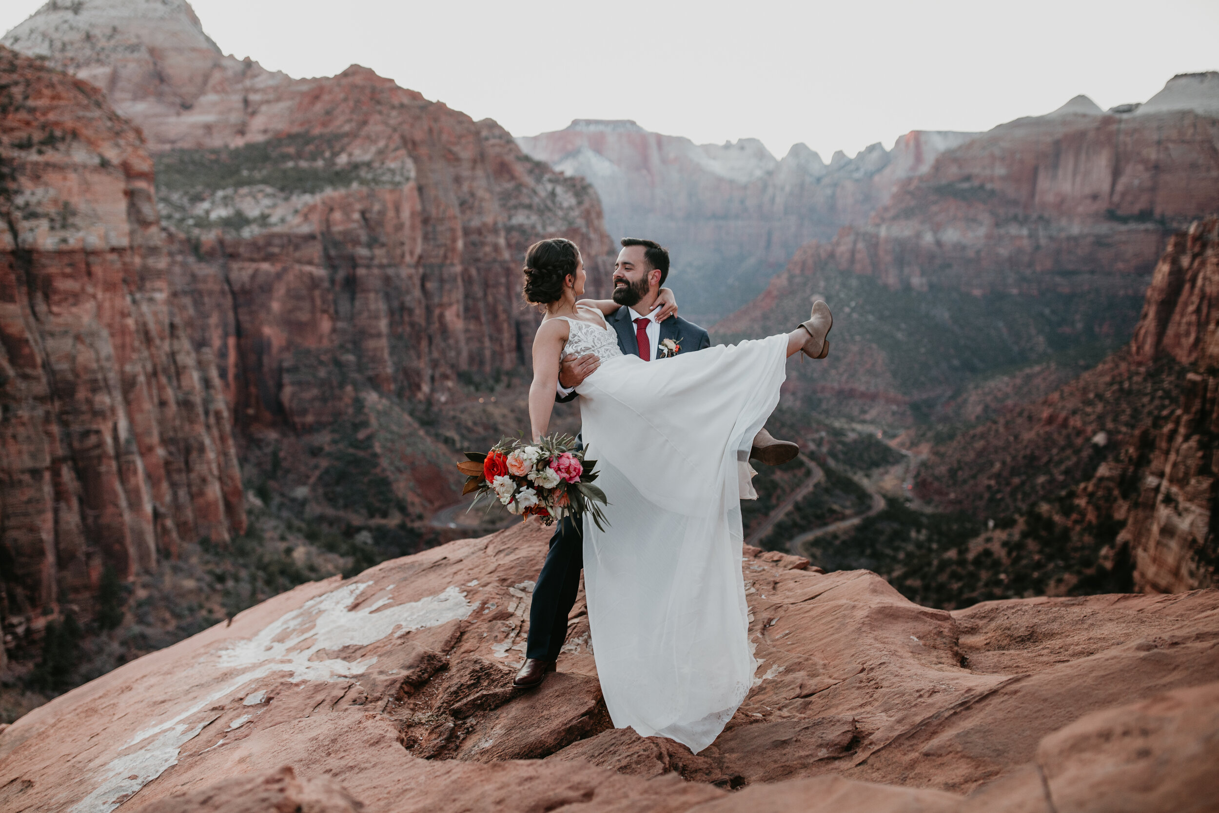 Nicole-Daacke-Photography-snowy-hiking-elopement-in-zion-national-park-zion-elopement-photographer-canyon-overlook-trial-brial-portraits-in-mt-zion-national-park-utah-desert-adventure-elopement-photographer-161.jpg