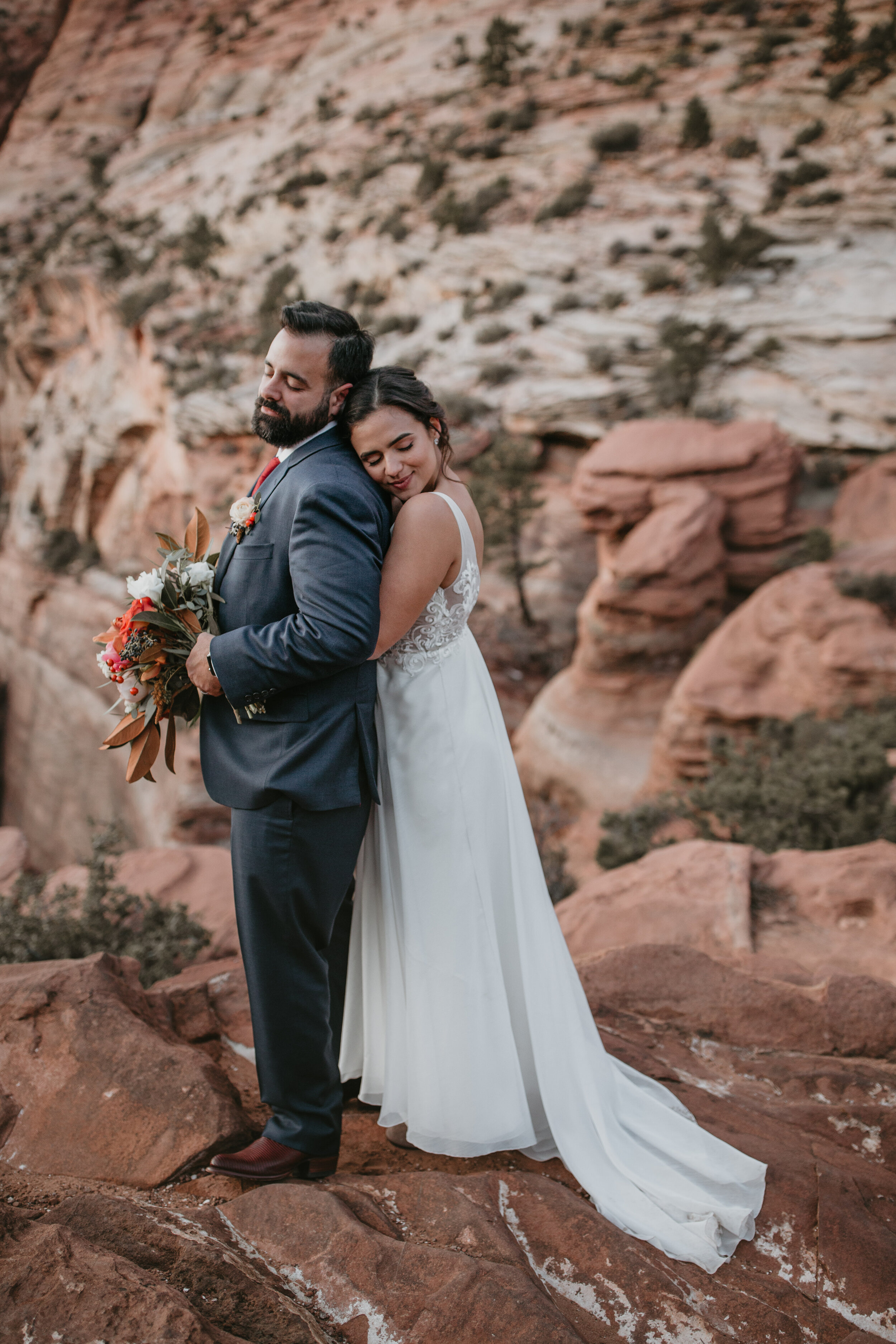 Nicole-Daacke-Photography-snowy-hiking-elopement-in-zion-national-park-zion-elopement-photographer-canyon-overlook-trial-brial-portraits-in-mt-zion-national-park-utah-desert-adventure-elopement-photographer-165.jpg