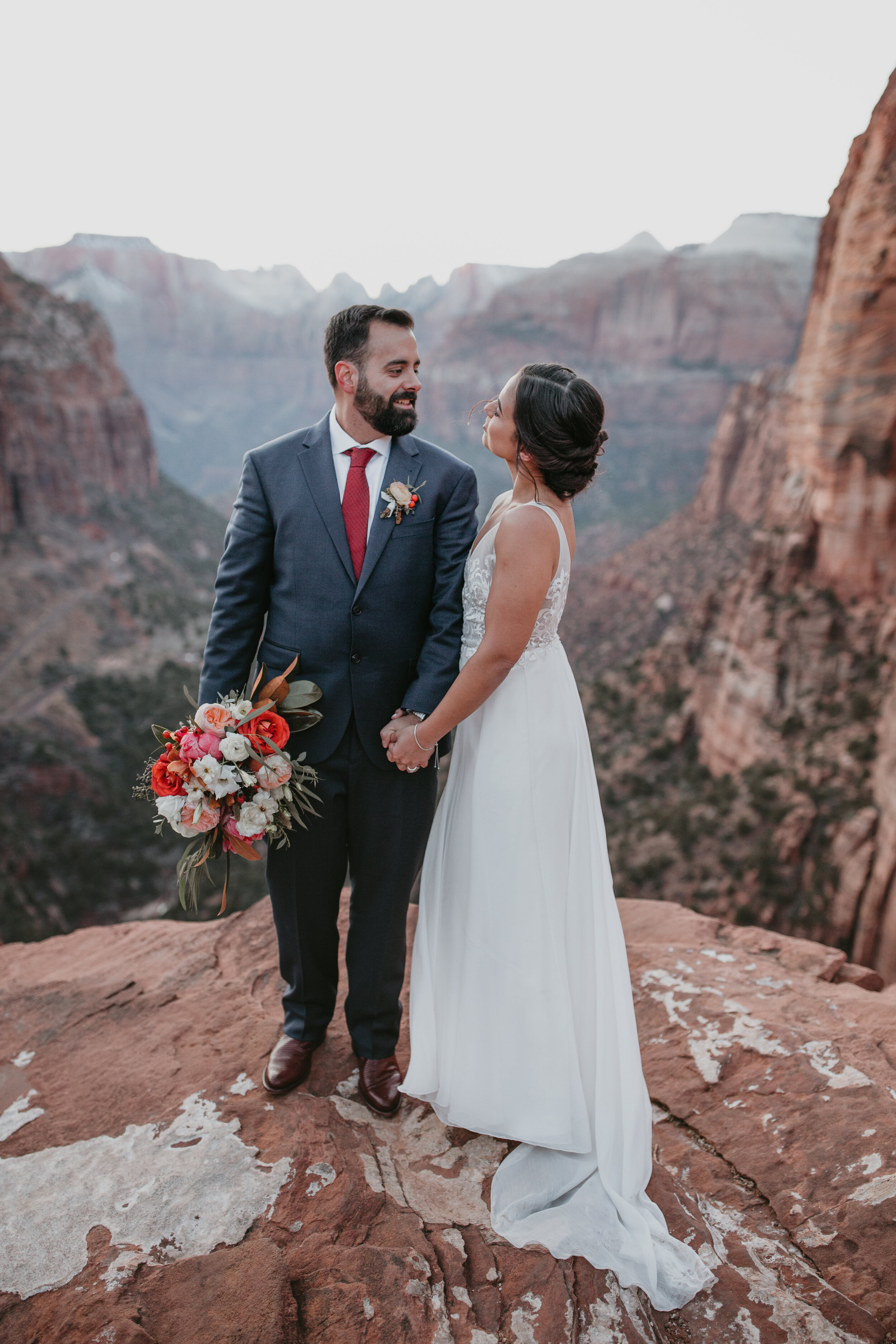 Nicole-Daacke-Photography-snowy-hiking-elopement-in-zion-national-park-zion-elopement-photographer-canyon-overlook-trial-brial-portraits-in-mt-zion-national-park-utah-desert-adventure-elopement-photographer-166.jpg