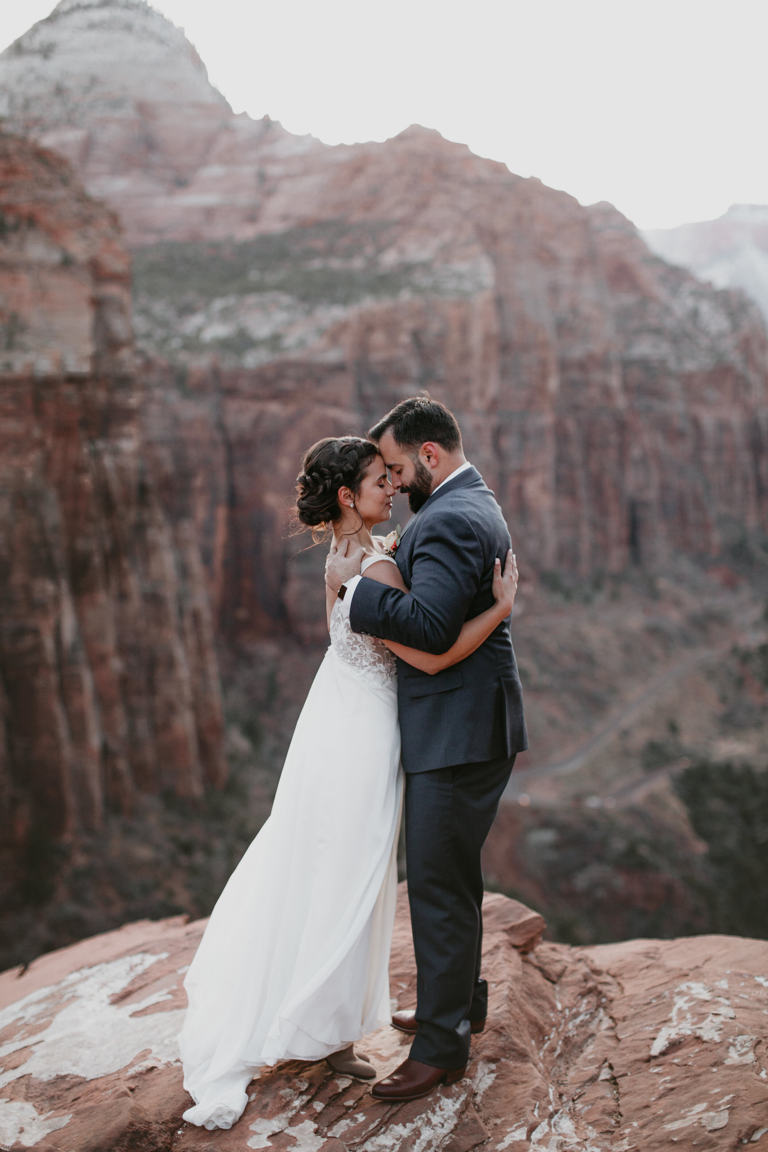 Nicole-Daacke-Photography-snowy-hiking-elopement-in-zion-national-park-zion-elopement-photographer-canyon-overlook-trial-brial-portraits-in-mt-zion-national-park-utah-desert-adventure-elopement-photographer-169.jpg