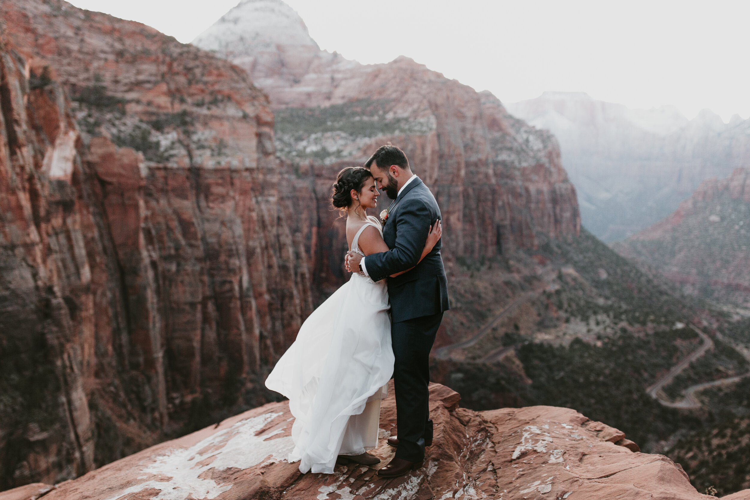 Nicole-Daacke-Photography-snowy-hiking-elopement-in-zion-national-park-zion-elopement-photographer-canyon-overlook-trial-brial-portraits-in-mt-zion-national-park-utah-desert-adventure-elopement-photographer-170.jpg