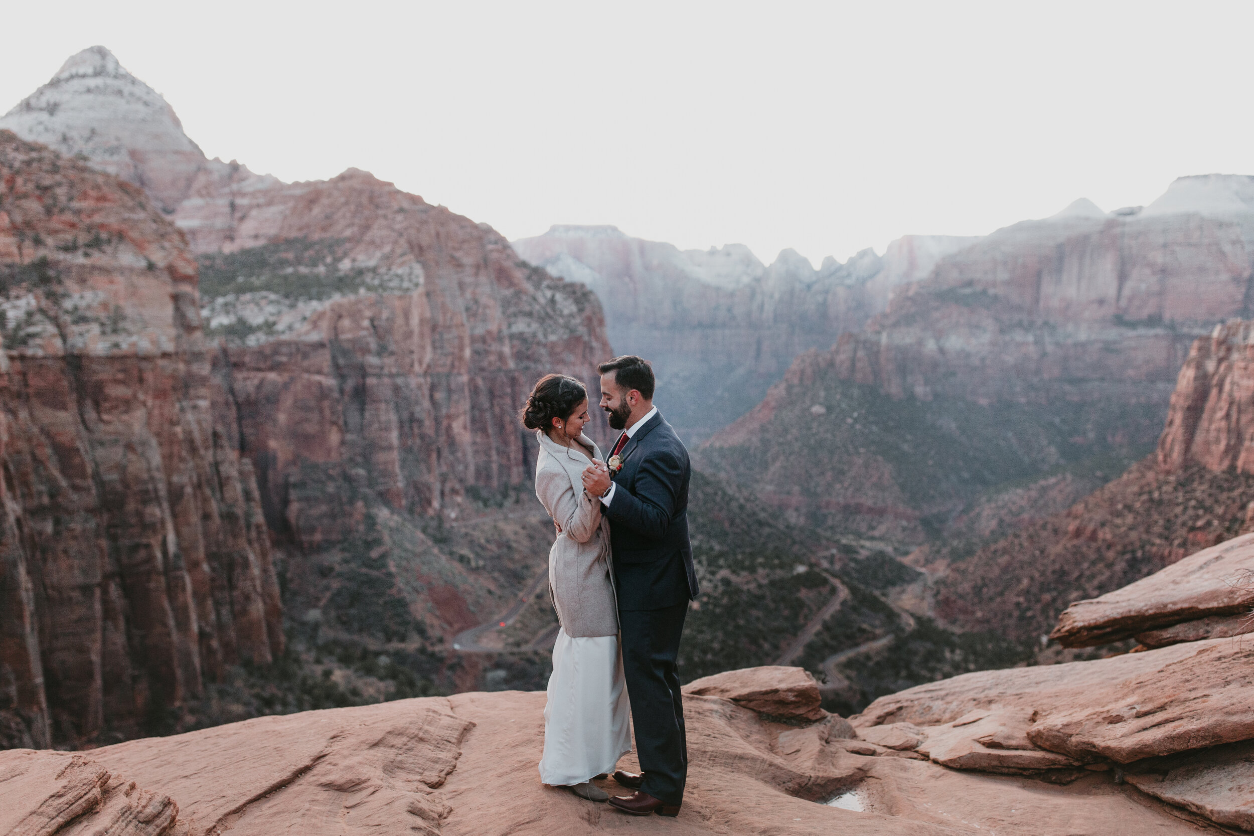 Nicole-Daacke-Photography-snowy-hiking-elopement-in-zion-national-park-zion-elopement-photographer-canyon-overlook-trial-brial-portraits-in-mt-zion-national-park-utah-desert-adventure-elopement-photographer-171.jpg