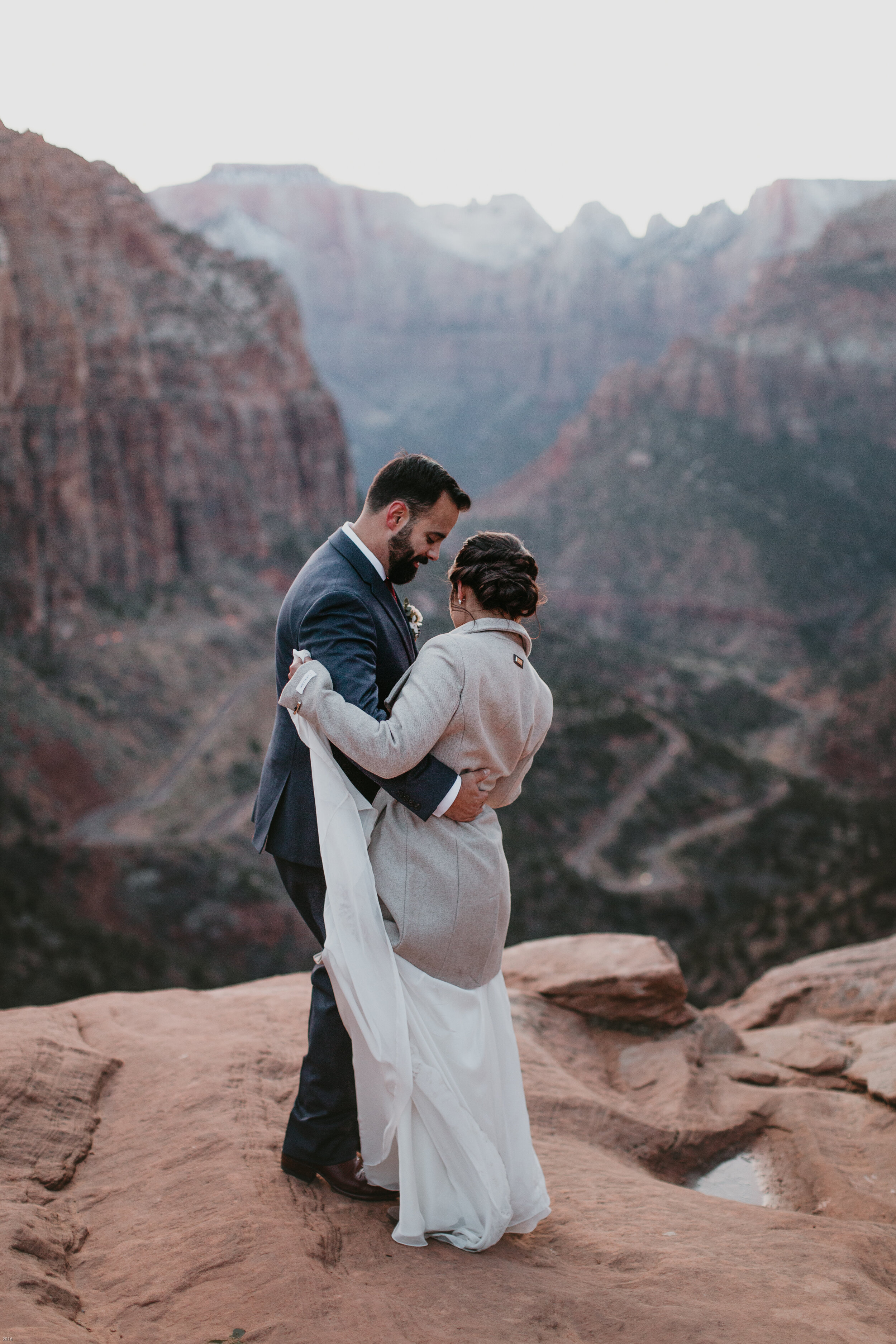 Nicole-Daacke-Photography-snowy-hiking-elopement-in-zion-national-park-zion-elopement-photographer-canyon-overlook-trial-brial-portraits-in-mt-zion-national-park-utah-desert-adventure-elopement-photographer-172.jpg