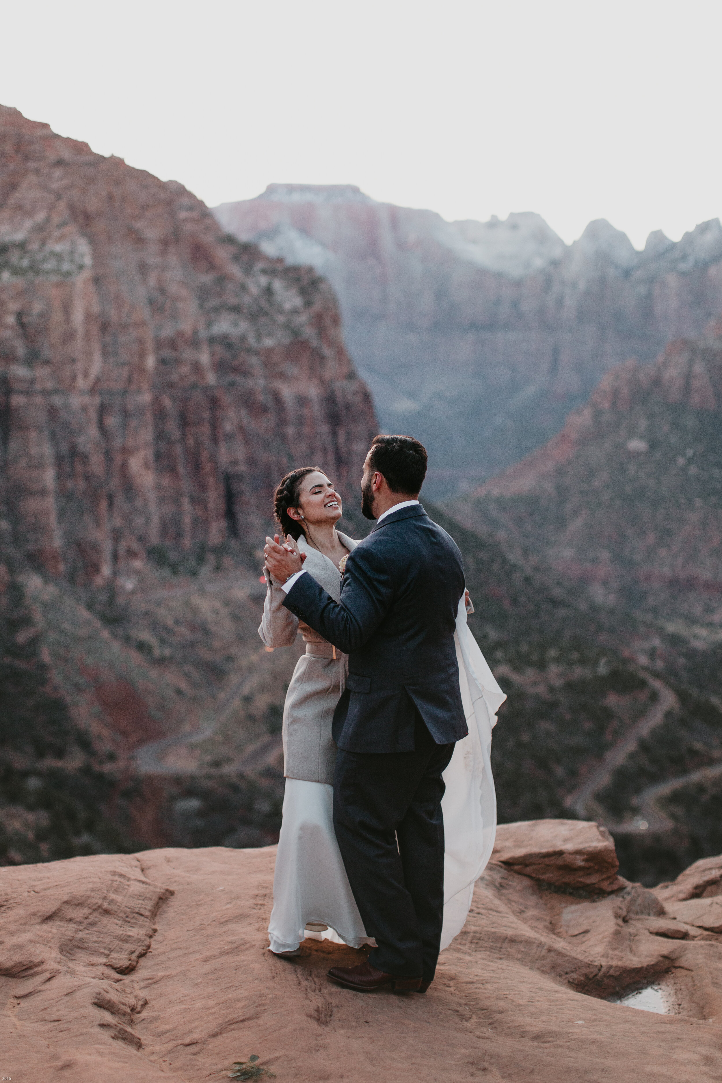 Nicole-Daacke-Photography-snowy-hiking-elopement-in-zion-national-park-zion-elopement-photographer-canyon-overlook-trial-brial-portraits-in-mt-zion-national-park-utah-desert-adventure-elopement-photographer-173.jpg