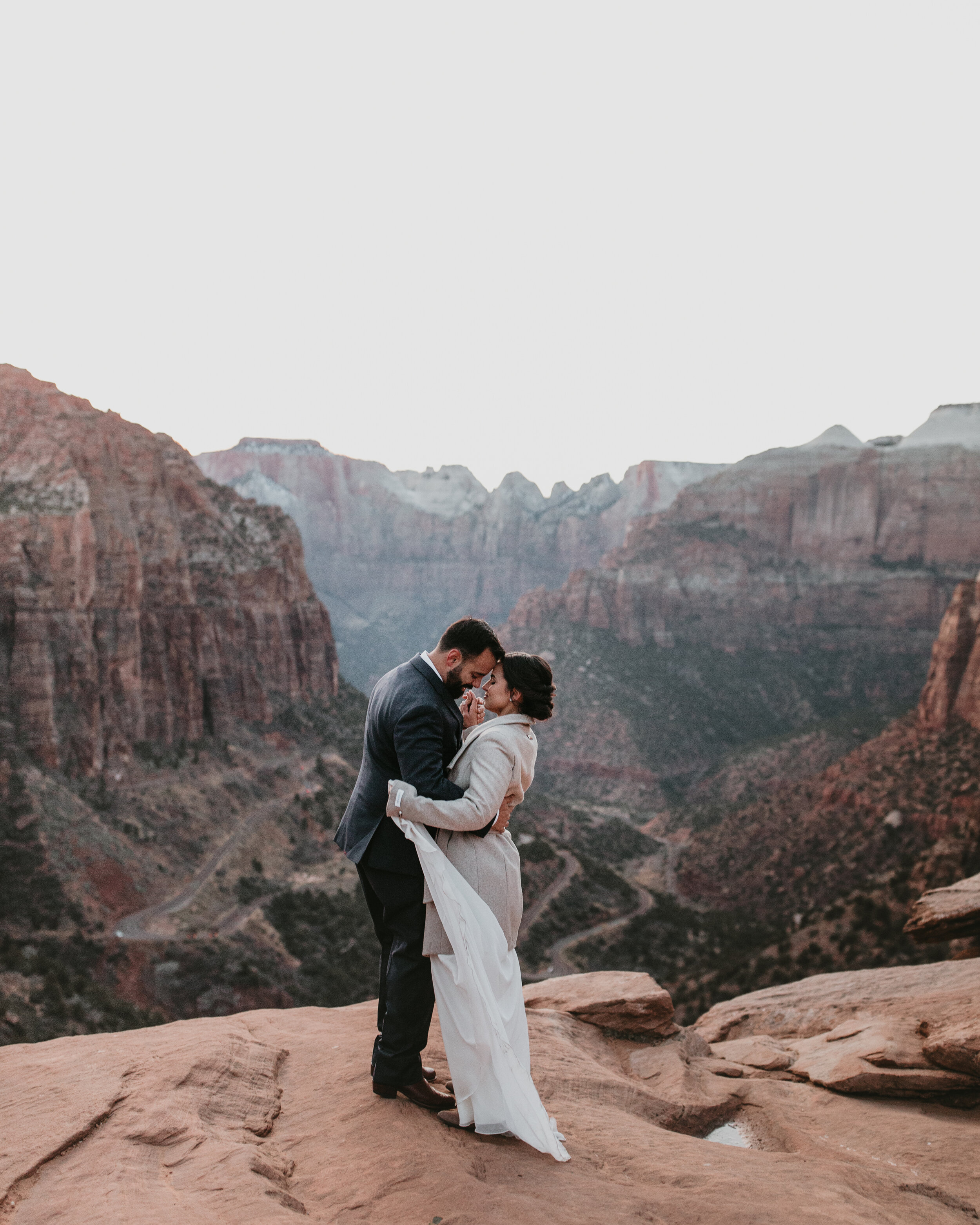 Nicole-Daacke-Photography-snowy-hiking-elopement-in-zion-national-park-zion-elopement-photographer-canyon-overlook-trial-brial-portraits-in-mt-zion-national-park-utah-desert-adventure-elopement-photographer-174.jpg