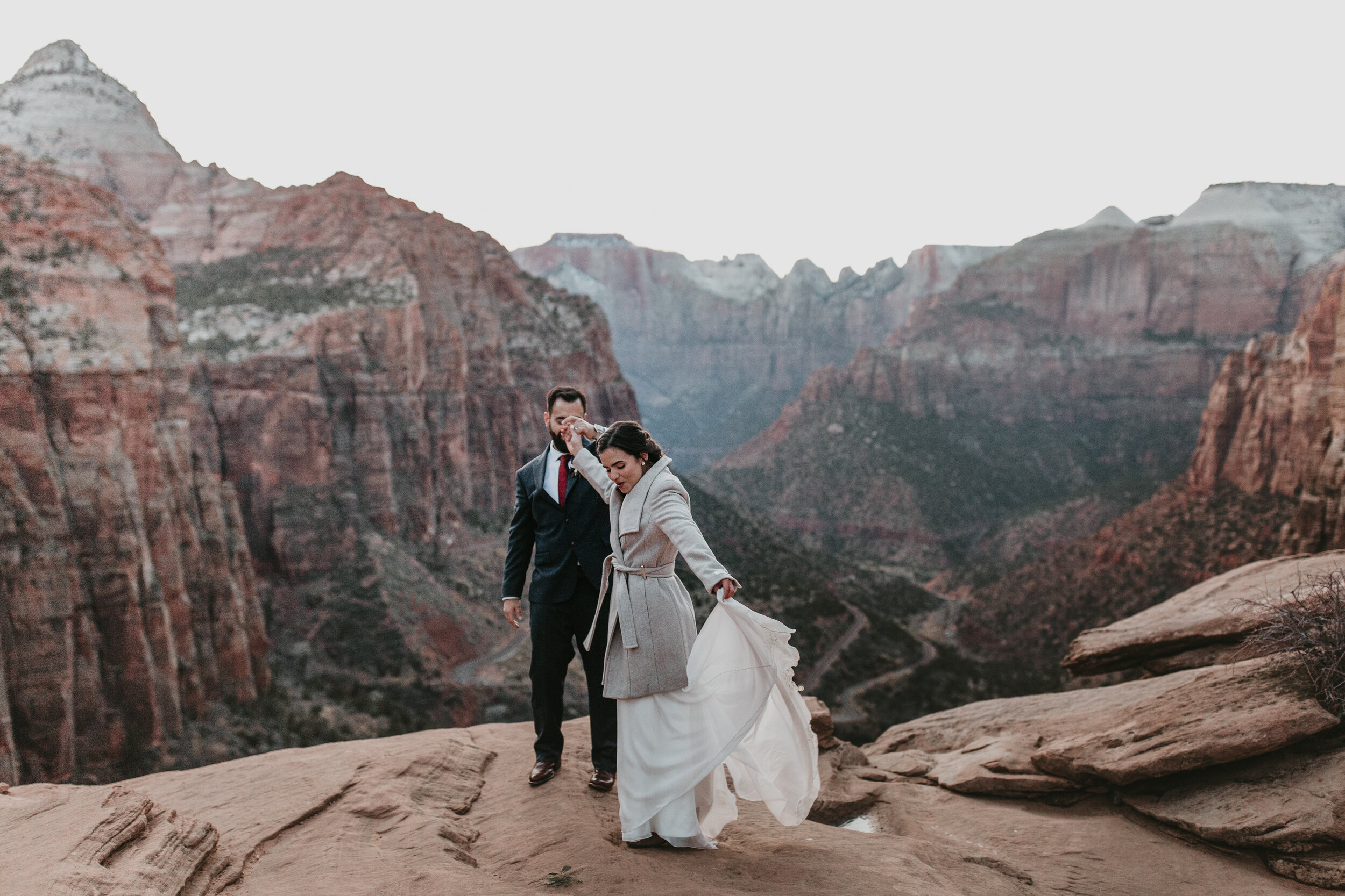 Nicole-Daacke-Photography-snowy-hiking-elopement-in-zion-national-park-zion-elopement-photographer-canyon-overlook-trial-brial-portraits-in-mt-zion-national-park-utah-desert-adventure-elopement-photographer-176.jpg