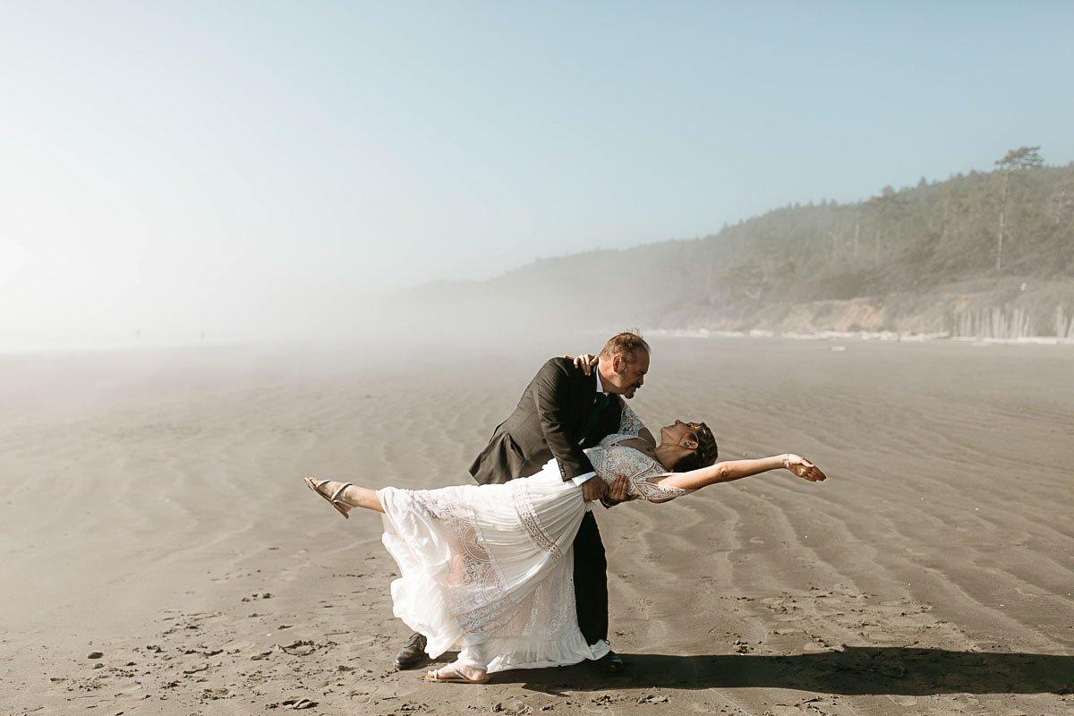  A couple does a dramatic dip during their elopement dance on Rialto Beach in Olympic National Park. 