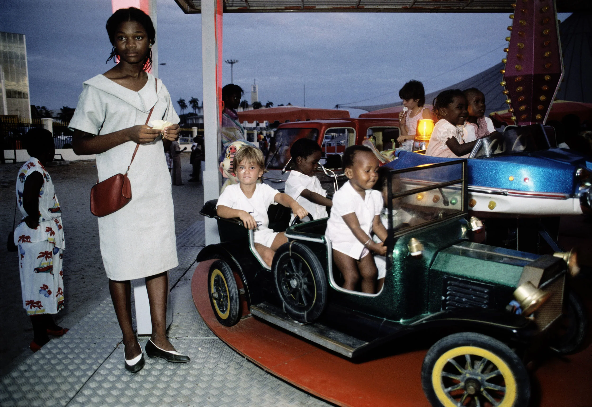 Car ride at a childrens amusement | Bruno Barbey