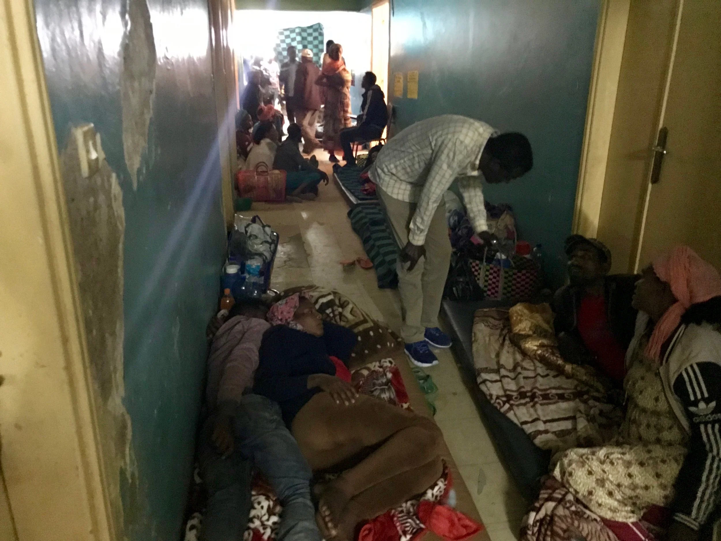 Patients were lined along the hallways on mattresses because there were no beds in the wards.