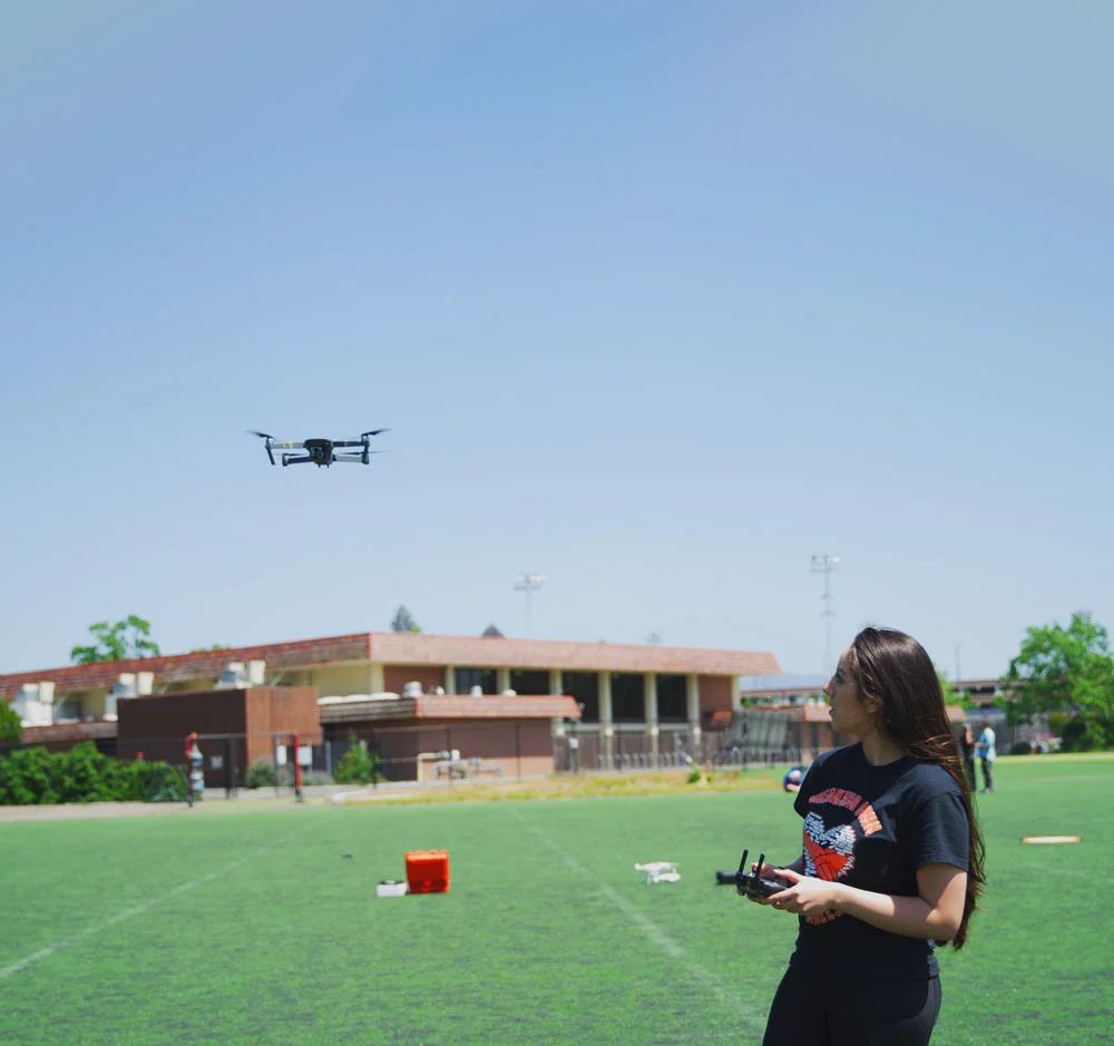 student_operating_a_flying_drone.jpg