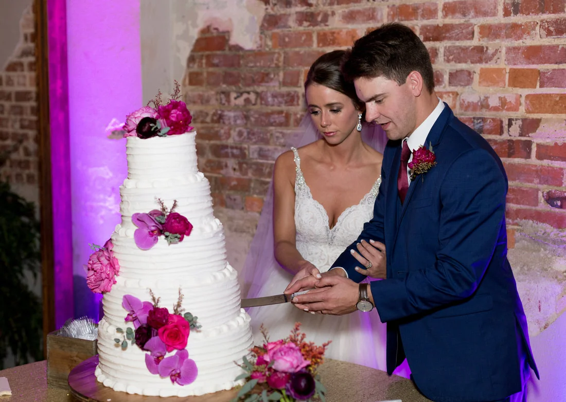wedding cake with bright purple and pinks.jpg