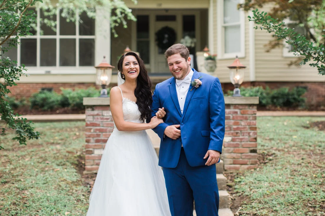 bride and groom with greenery background.jpg