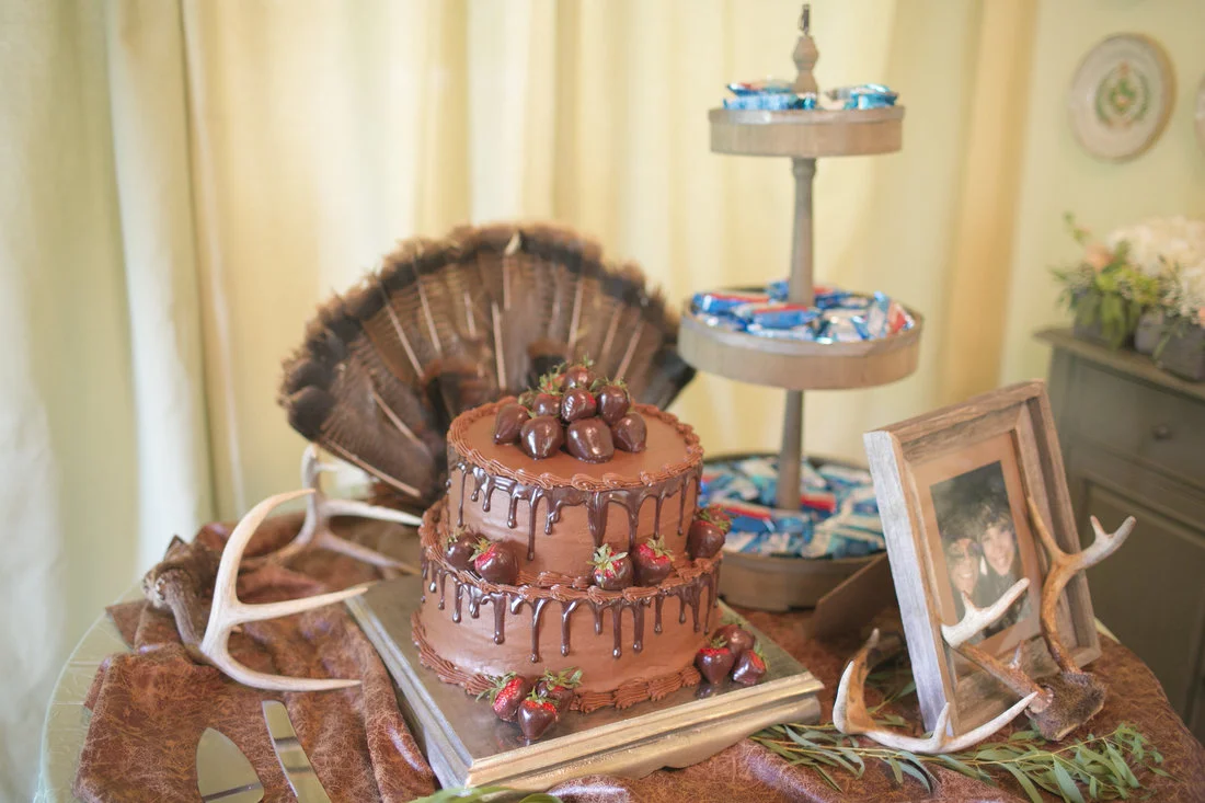The yummy chocolate and strawberry groom's cake was the centerpiece to a table full of memorabilia from Jennings' life; his trophies, his favorite drinks, and his favorite snacks!