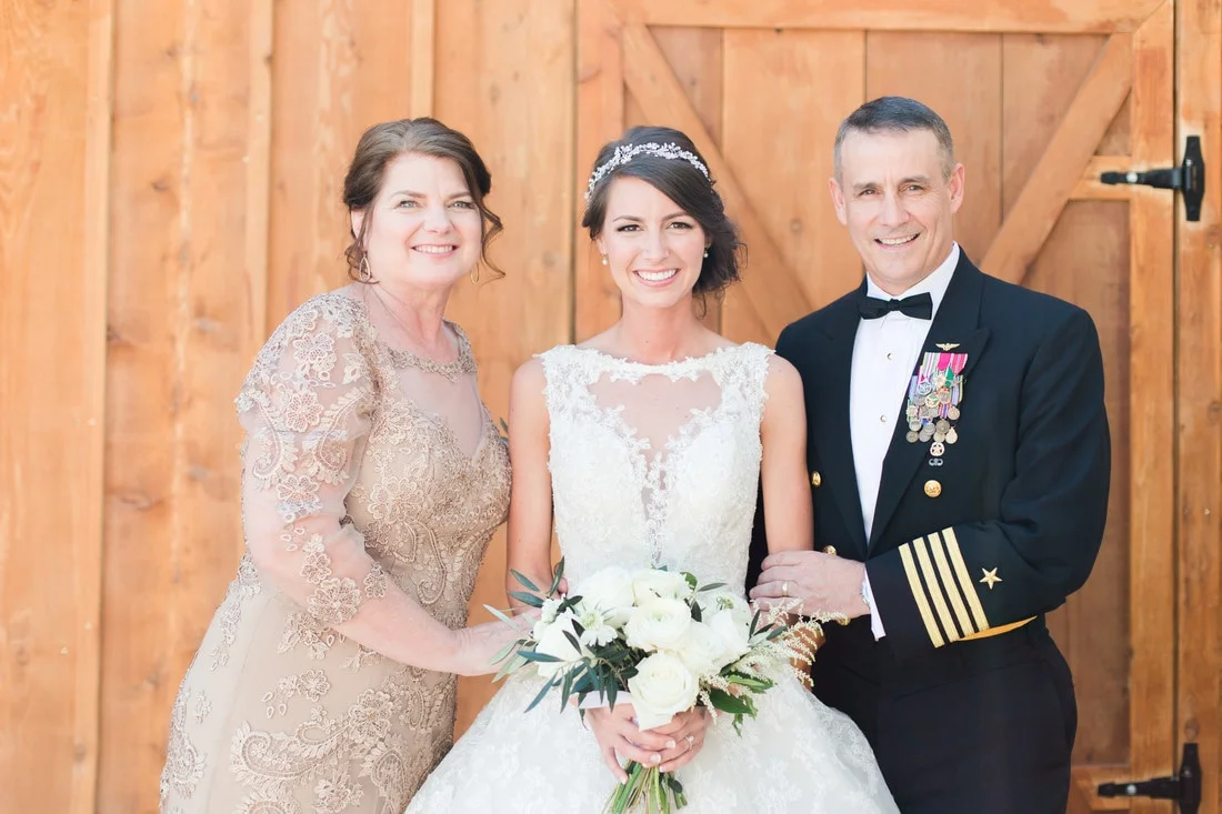 bride with parents picture.jpg