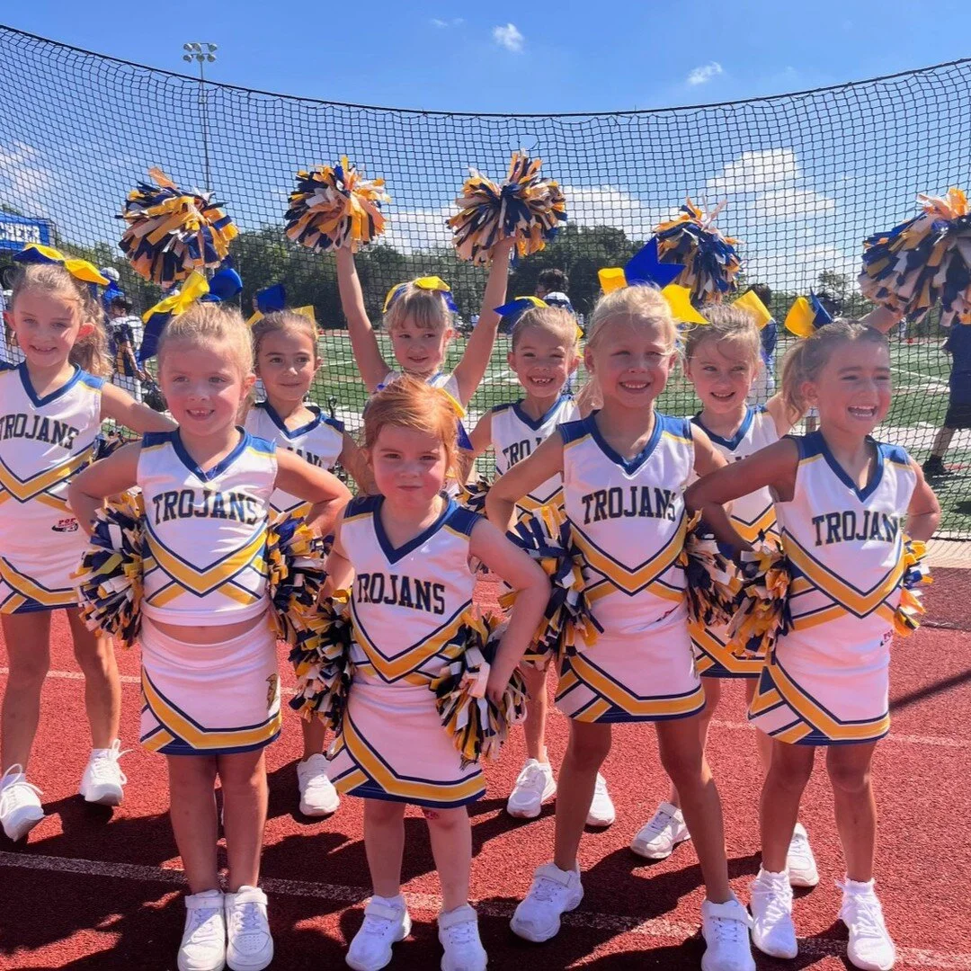 WEEK 4: Trojans Pop Warner cheerleaders are the BEST! Here is our Tiny Mite Team cheering on the U12 team this weekend!