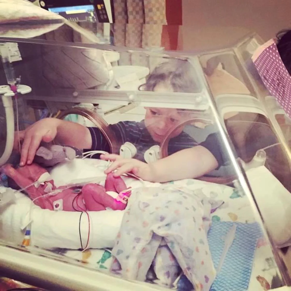Jacquline’s sons checking in on baby sister