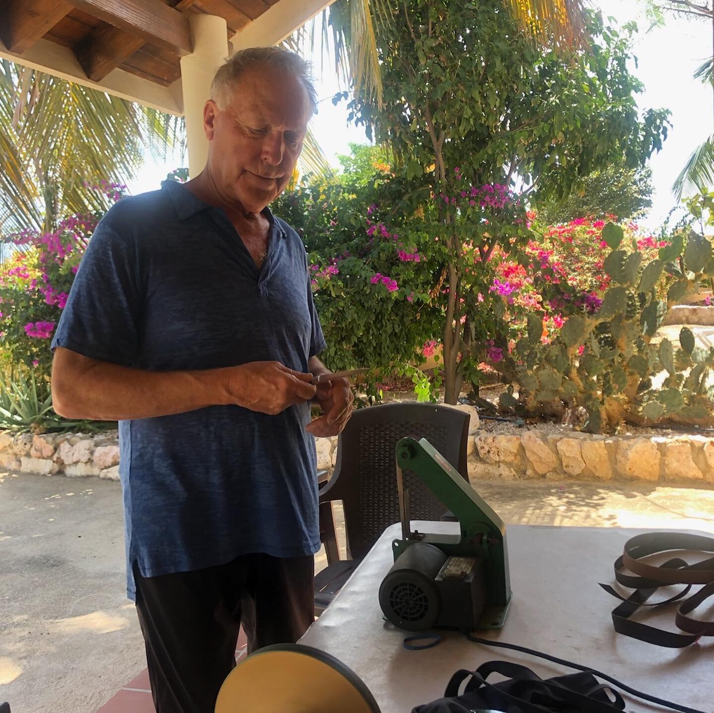 Sharpening for fish in Cura&ccedil;ao today. An old friend Romancho (76), after years of preferring to walk around barefoot, is now wearing sandals.