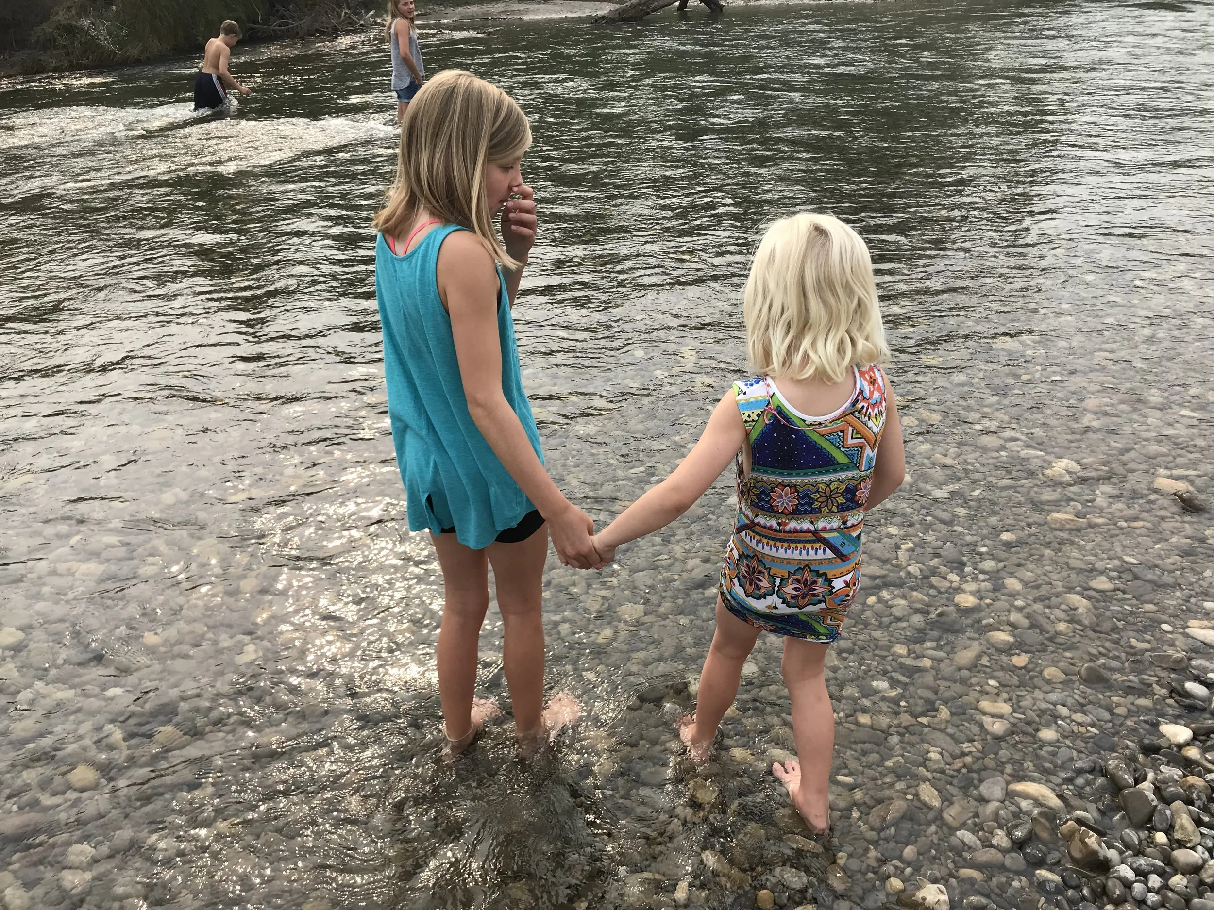 Zoe & Kiara wading in Elbow River, Calgary.