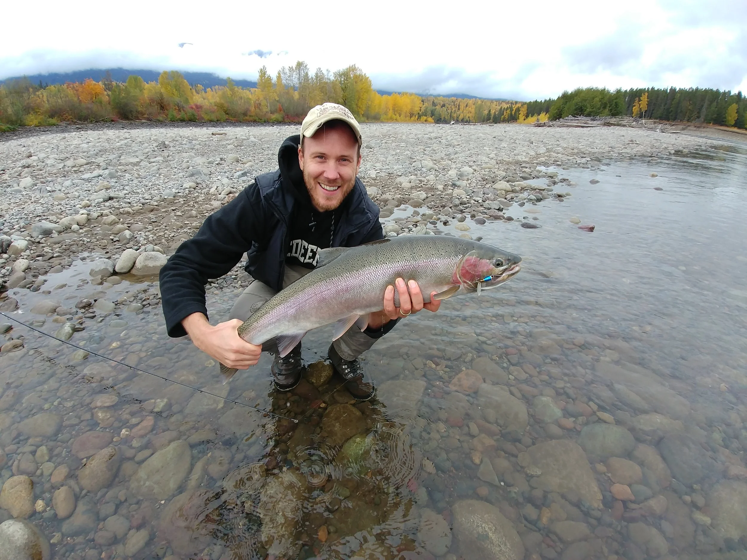 John caught it…and let Jer reel it in. What a host! And what a gorgeous steelhead! Jer, you look good, too, hon…