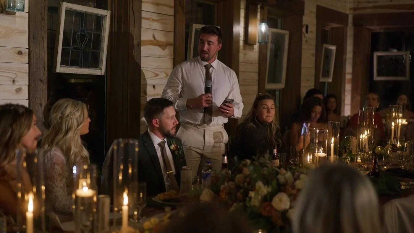 A best man giving a toast by candlelight