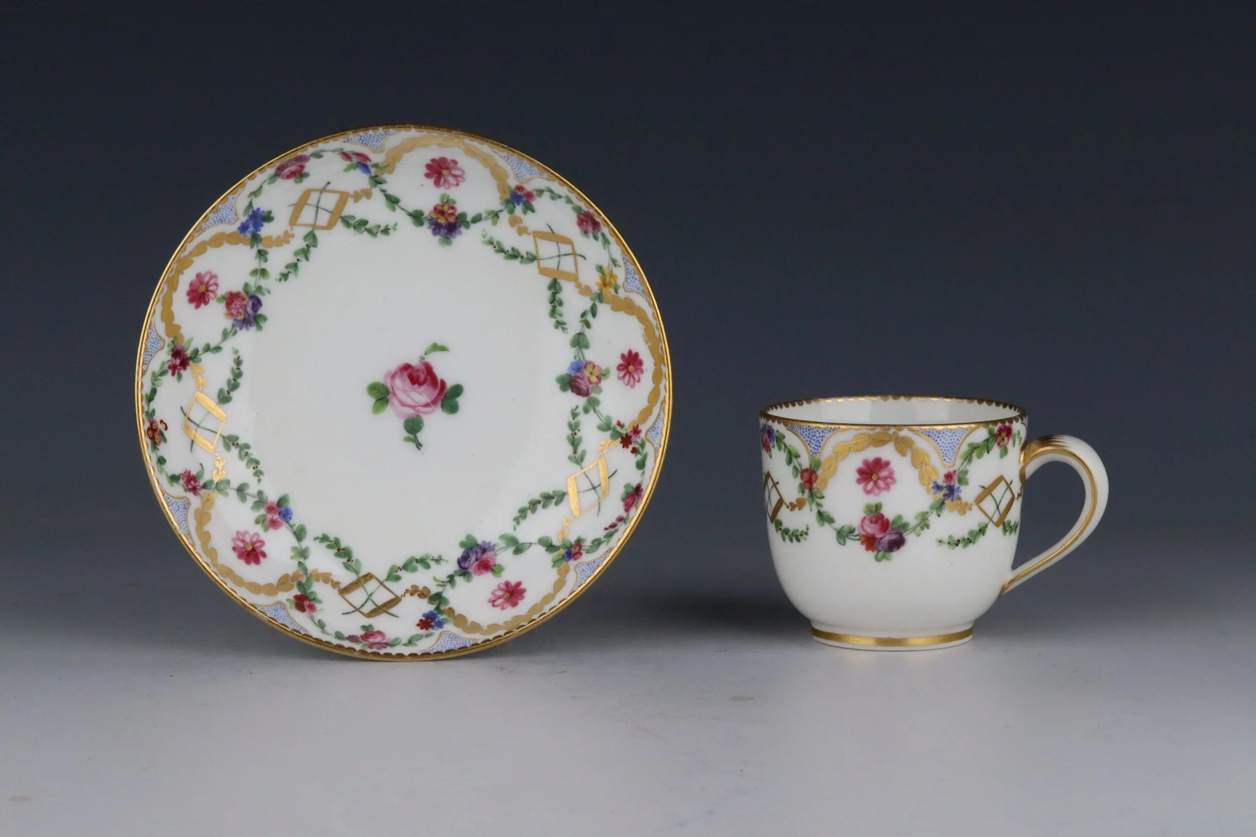 Sèvres cup and saucer decorated with polychrome and gilt flower garlands, c.1768-75