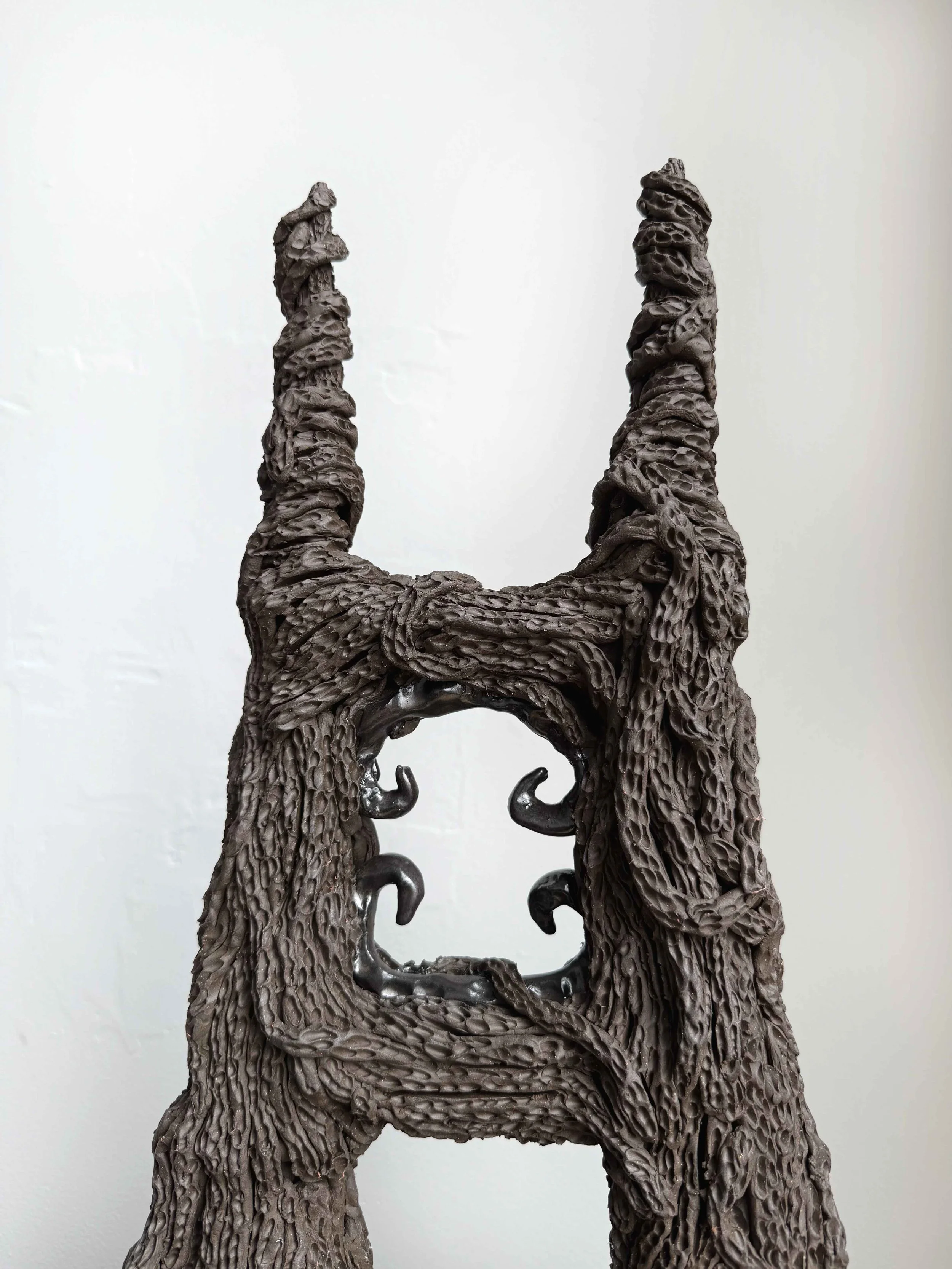   What Still Remains?  (detail)  2026  ceramic, glaze  20” x 15.5” x 41.5”    