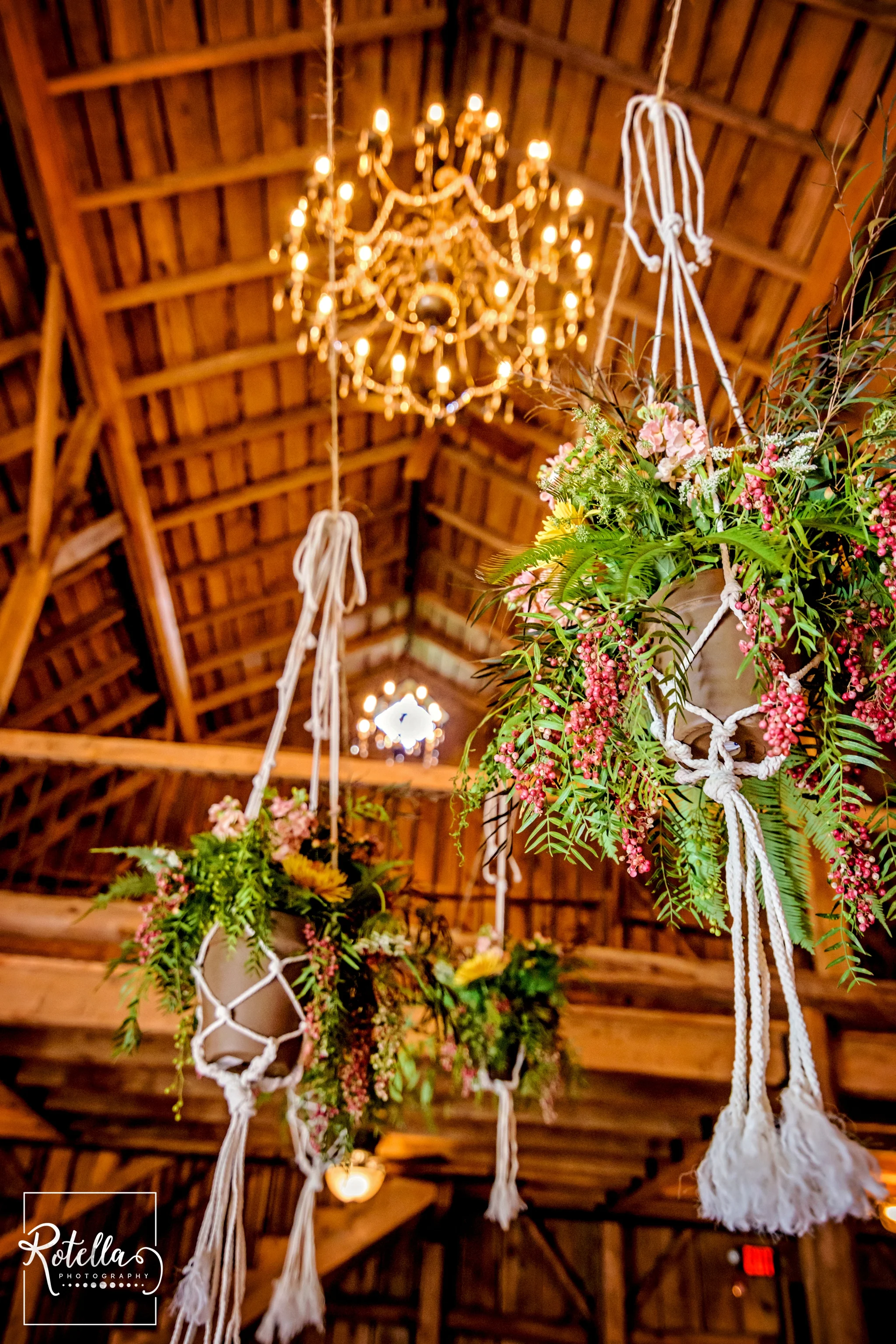 Hanging floral baskets in barn by Hadley Road