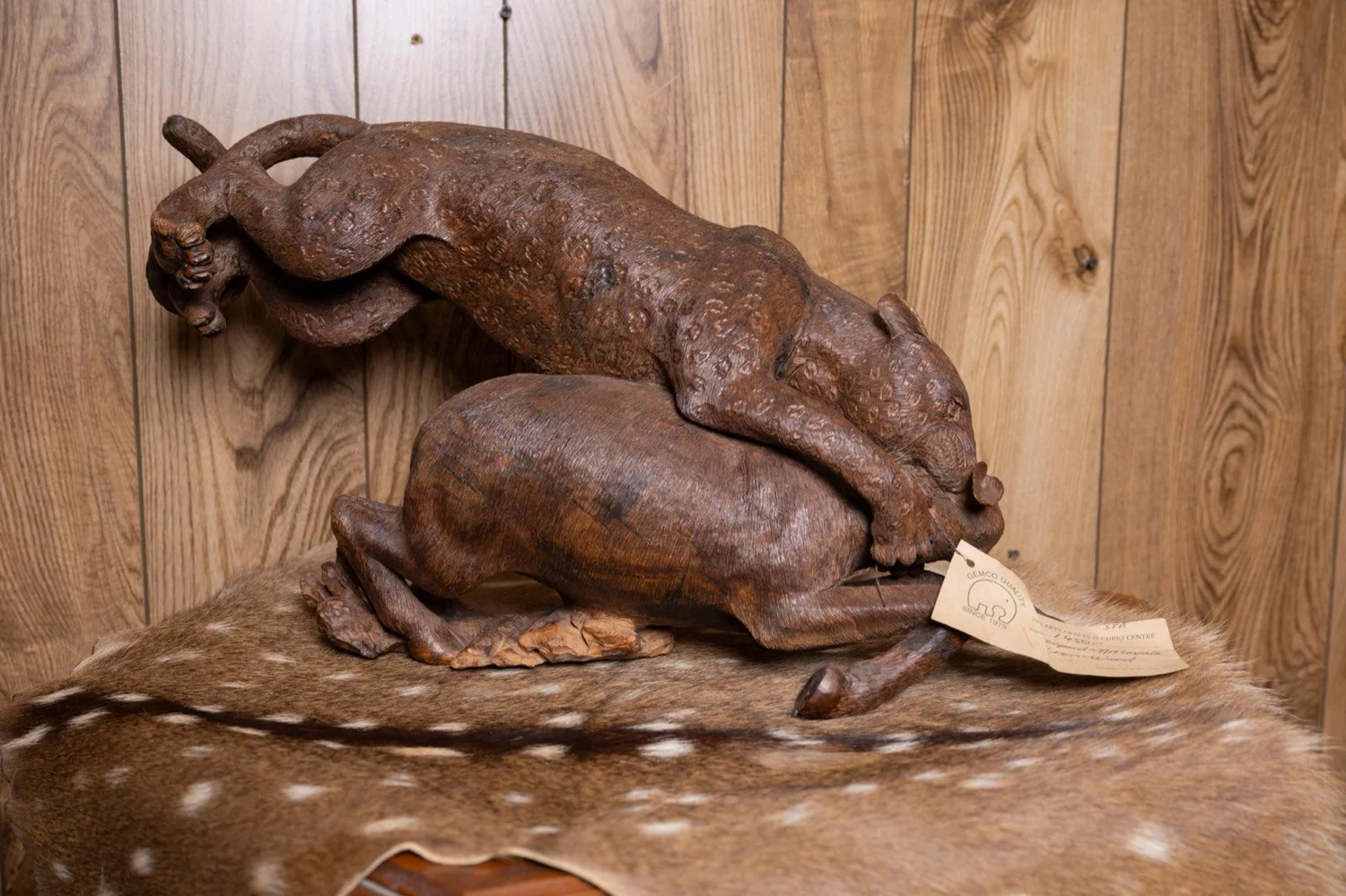 Leopard attacking impala carved in ironwood, South Africa, view 3