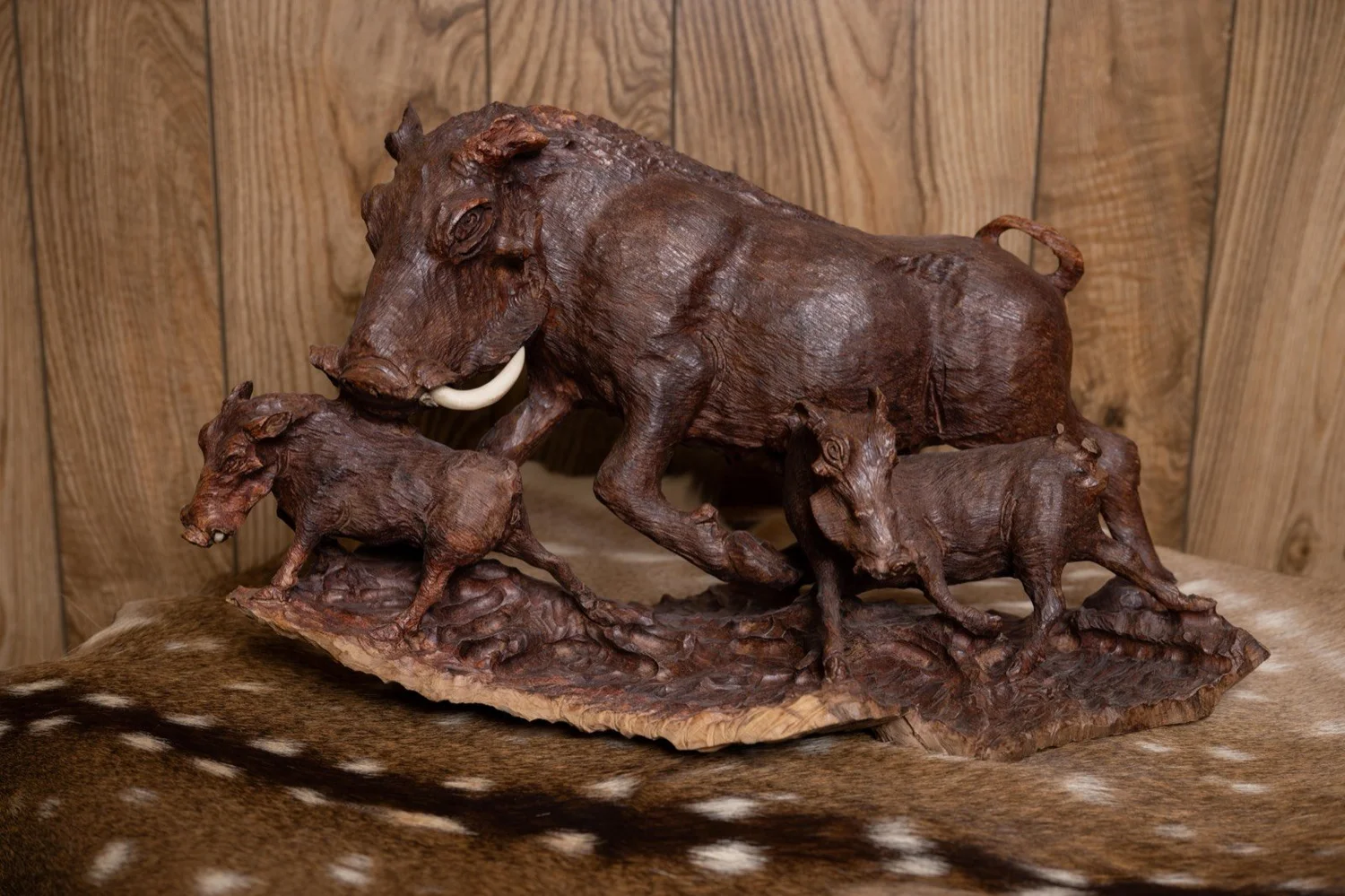 Warthog family carved in ironwood, South Africa, view 1