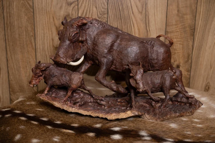 Warthog family carved in ironwood, South Africa