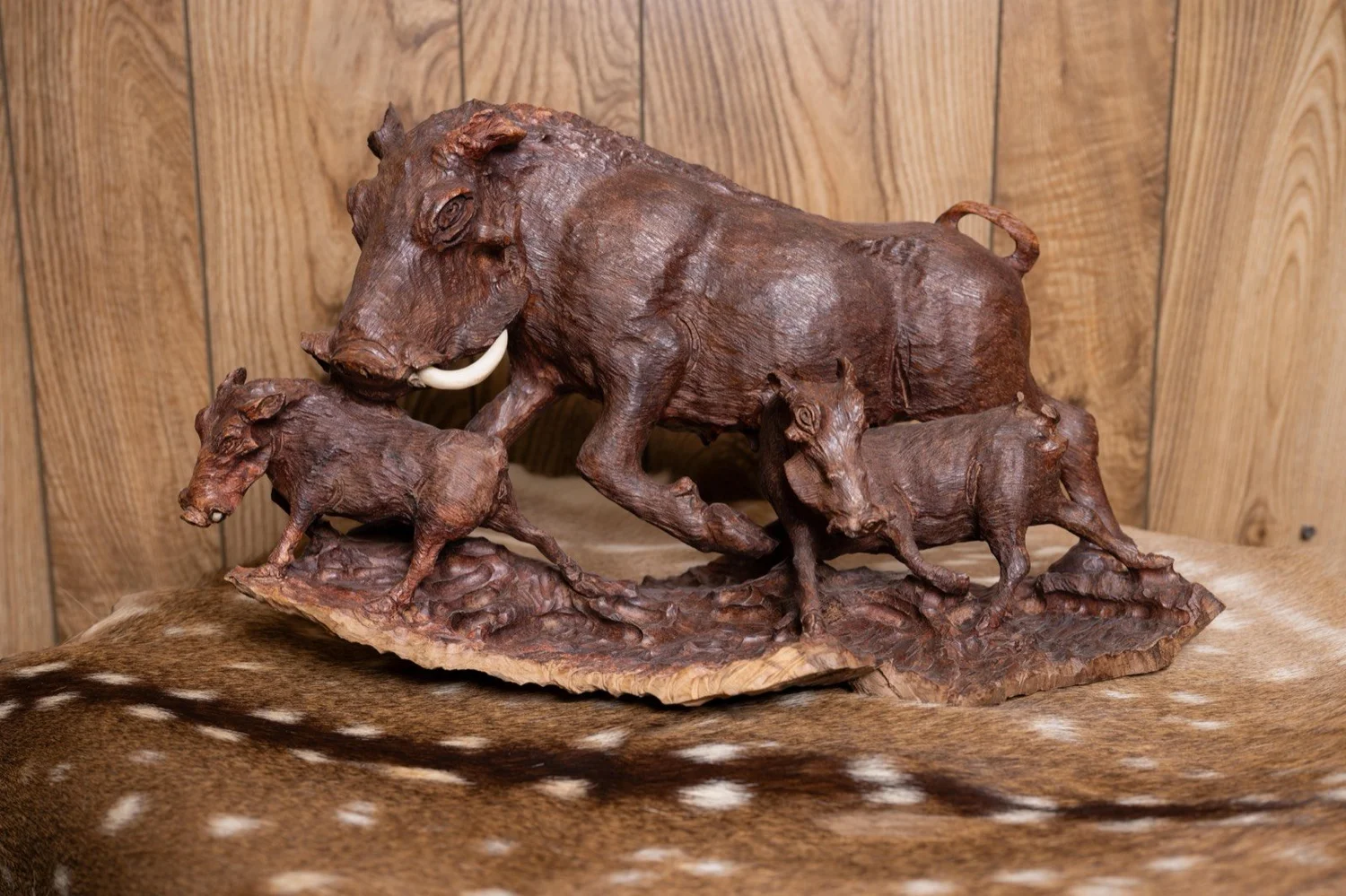 Warthog family carved in ironwood, South Africa, view 2